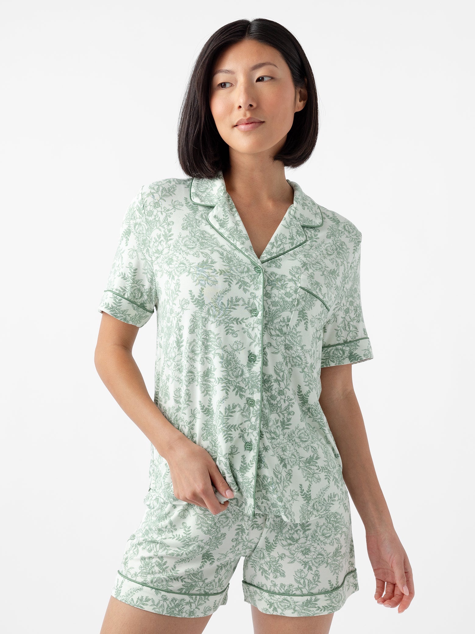 Woman in short sleeve celadon toile pajama set with white background 