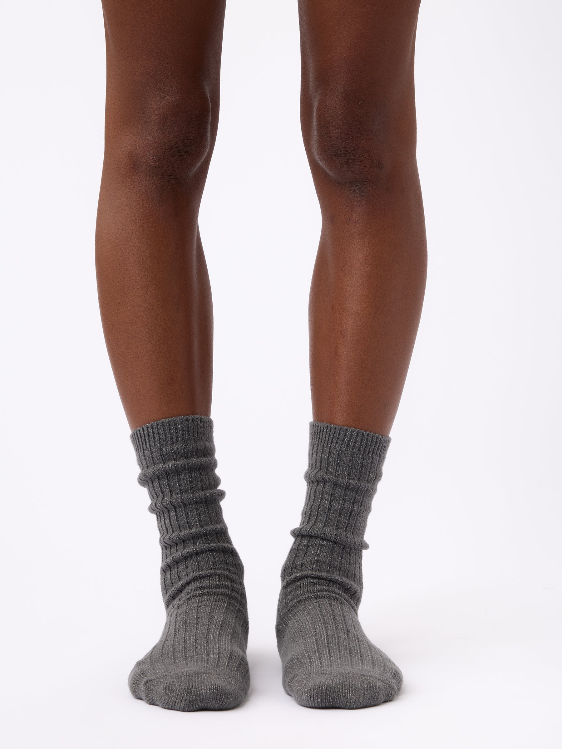 Person wearing Cozy Earth Plush Lounge Sock in Coal 
