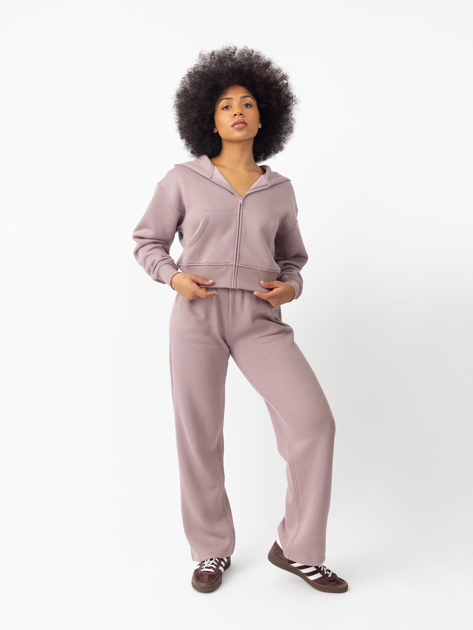 Woman wearing Dusty Orchid CityScape Wide Leg Pant with white background 