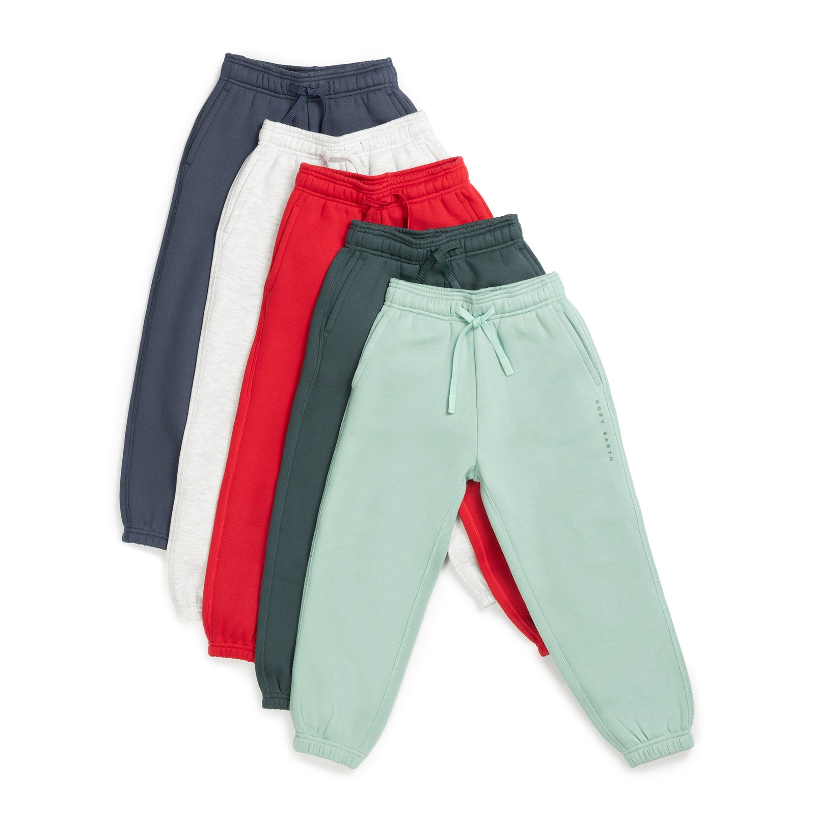 A collection of Kid's CityScape Sweatpants by Cozy Earth is showcased in an array of colors including navy blue, light gray, red, dark green, and light green. These sweatpants feature elastic waistbands with drawstrings and elastic cuffs for comfort and style. 