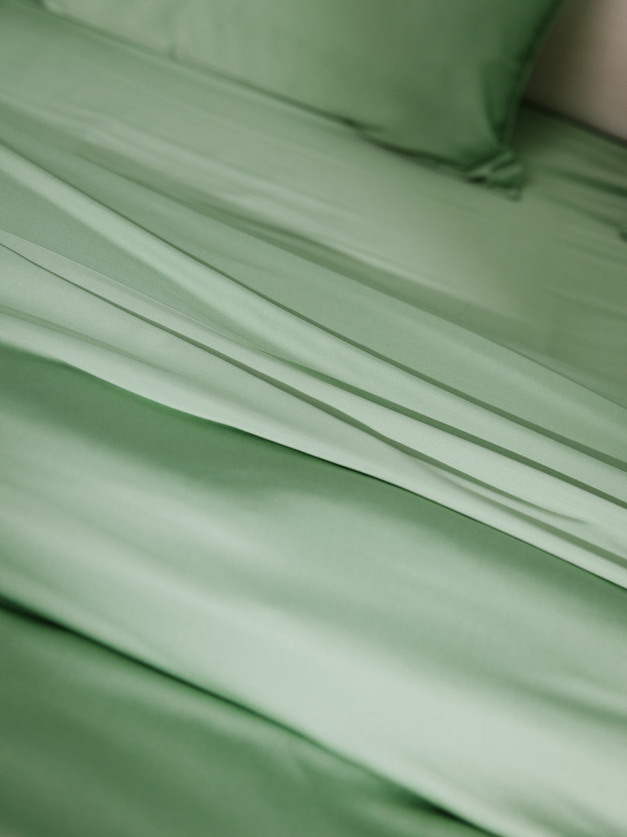 Close up texture shot of fern colored sheet set |Color:Fern