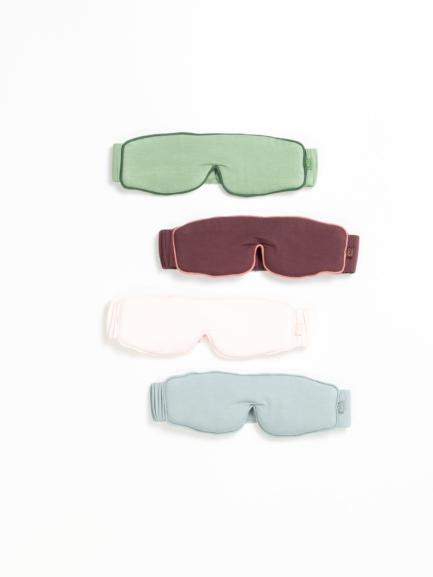 Flat lay of four different colors of sleep masks and white background |Color:Fern/Jade