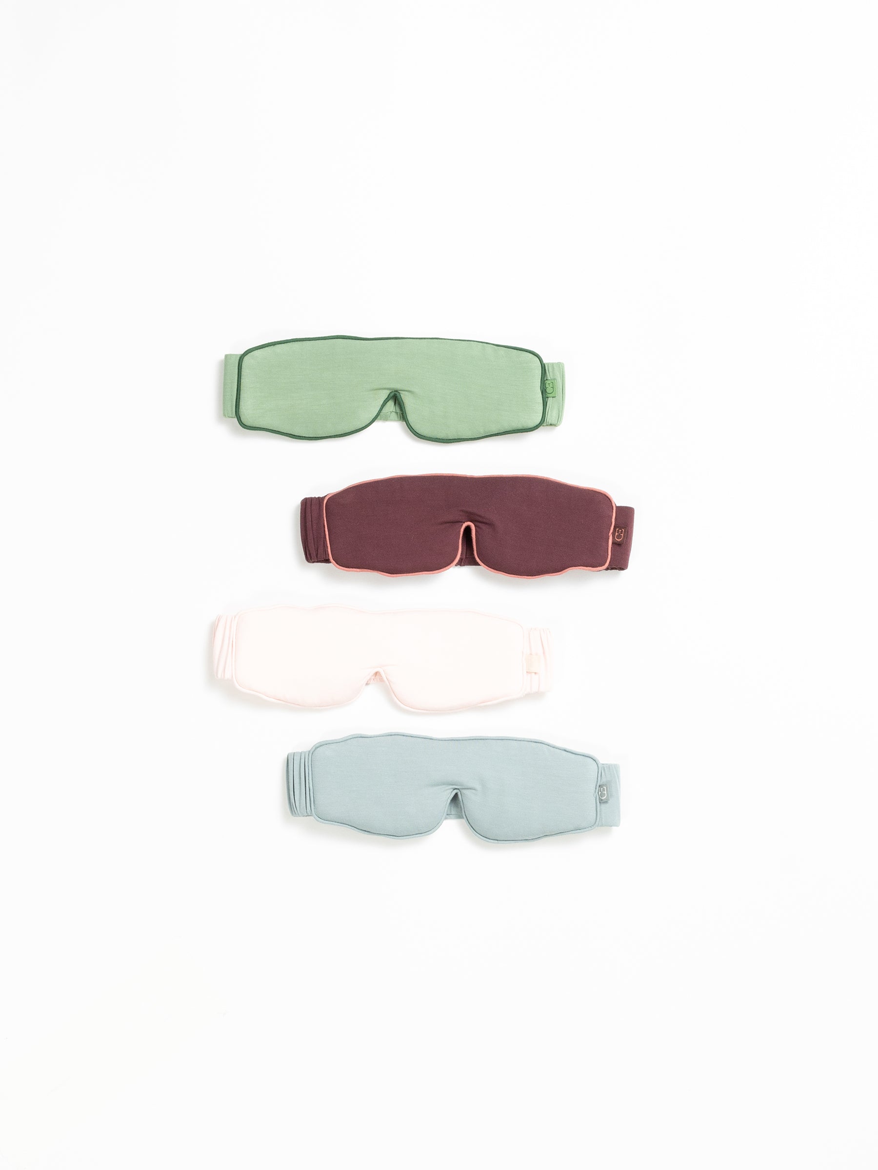 Flat lay of four different colors of sleep masks and white background |Color:Fern/Jade