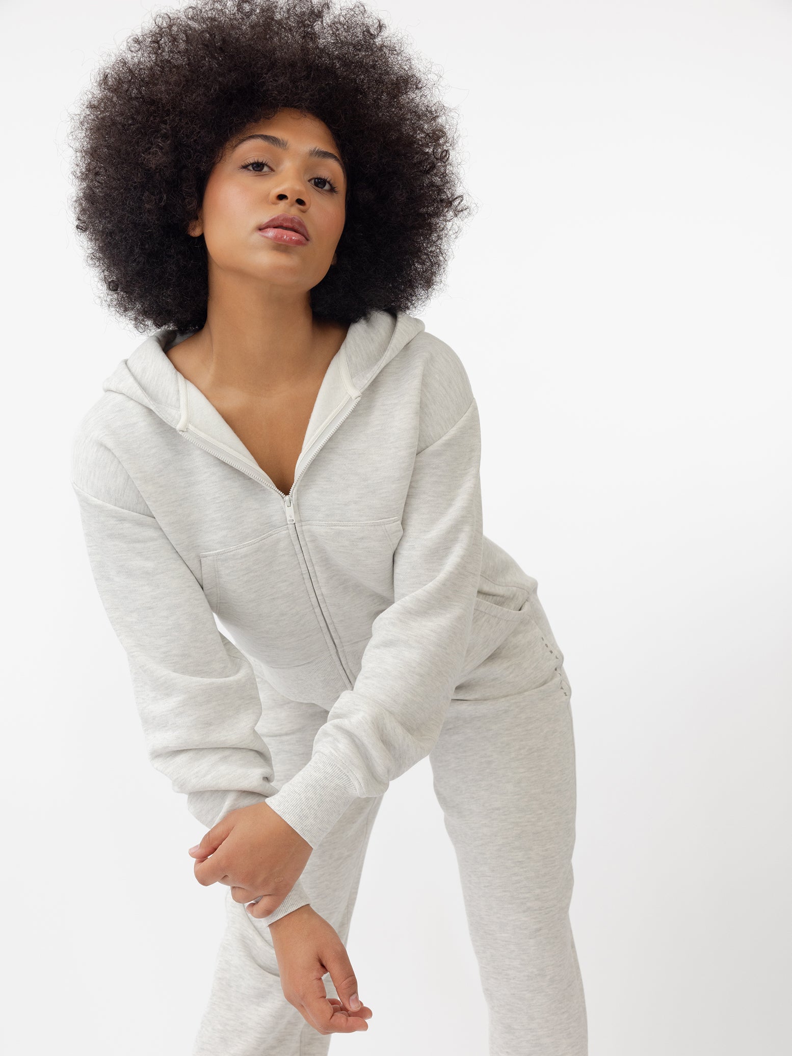 Woman wearing Heather Grey CityScape Cropped Full Zip with white background 