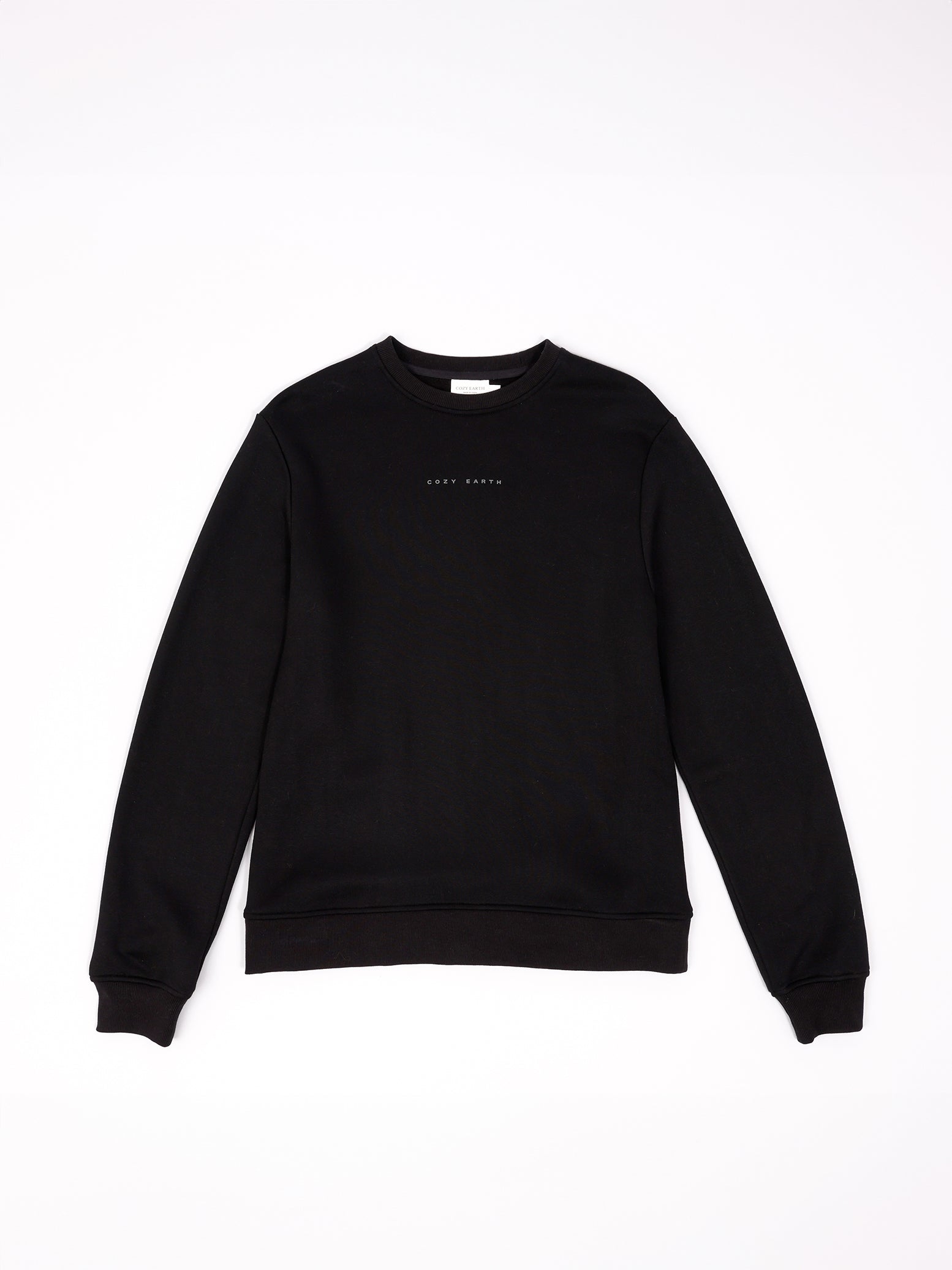 Flat lay of black cityscape pullover with white background 