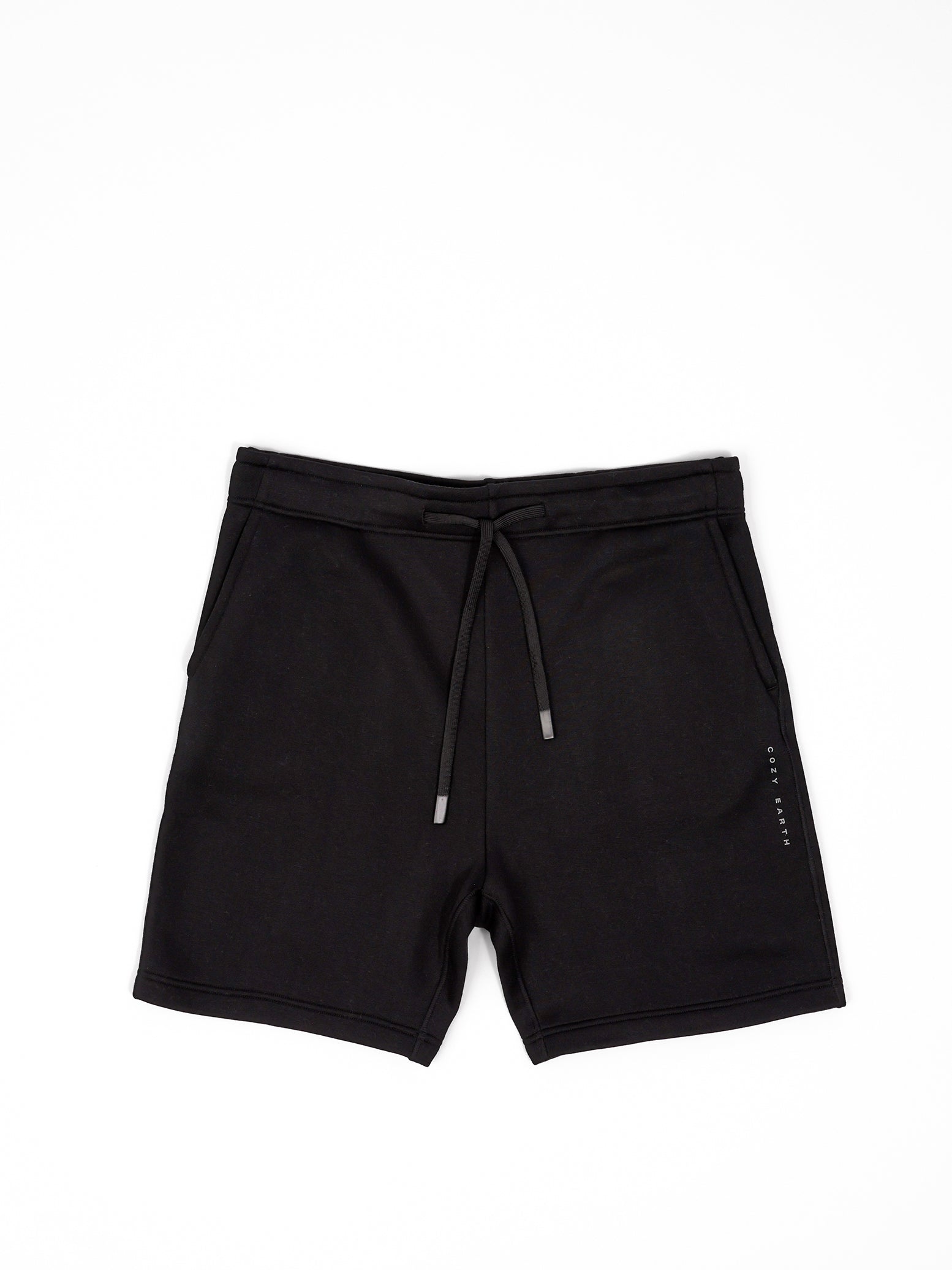 Flat lay of black cityscape shorts with white background 