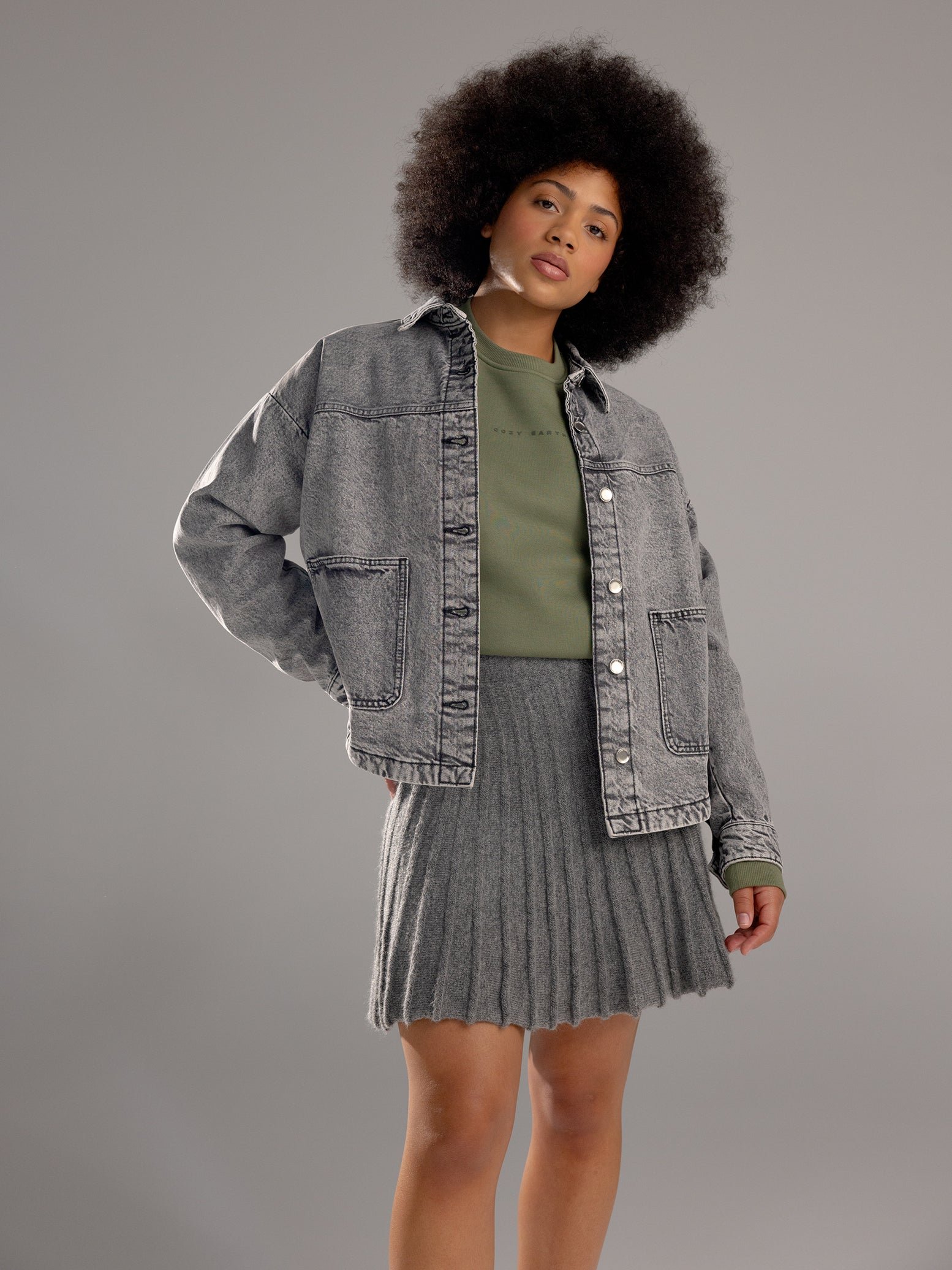 Woman wearing Juniper CityScape Crewneck with grey background 