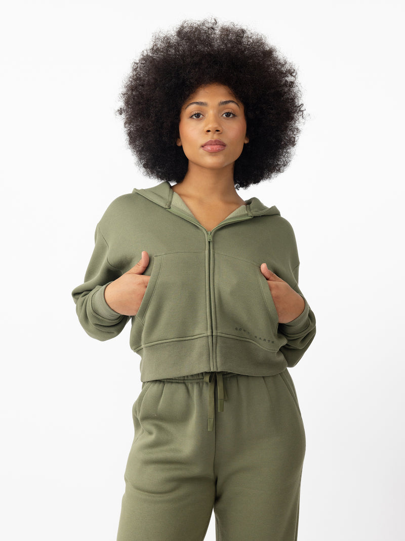 Woman wearing Juniper CityScape Cropped Full Zip with white background