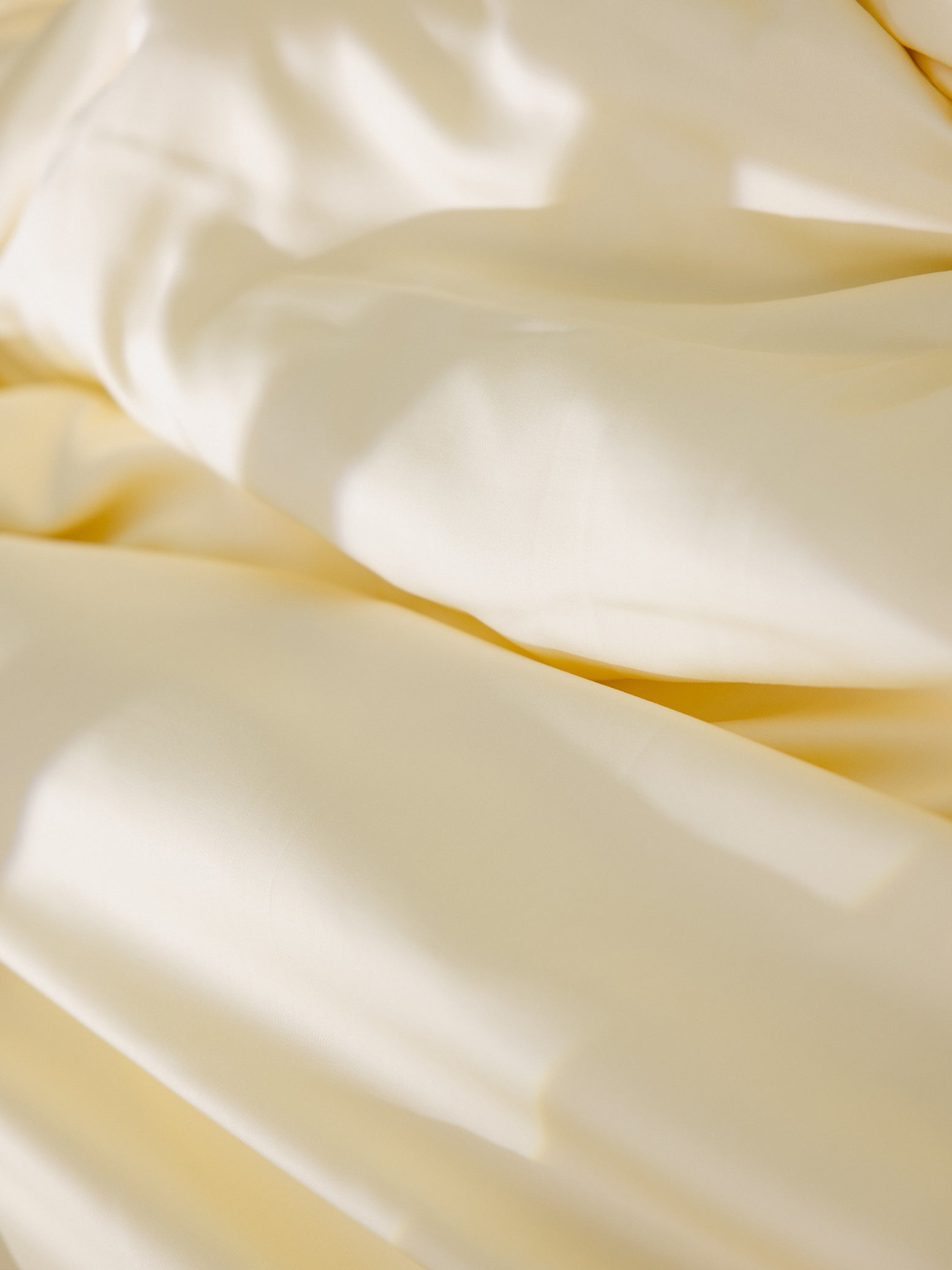 Lemonade Sheets on bed. Photo taken close up. 