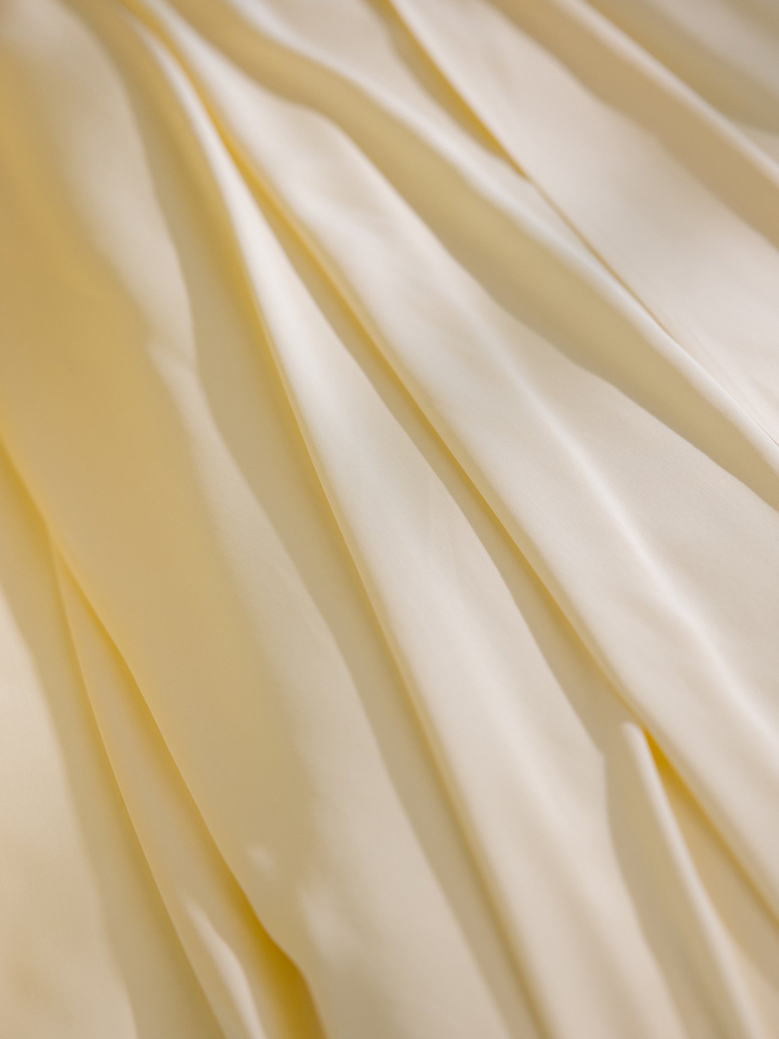 Lemonade Sheets on bed. Photo taken close up standard/king. 