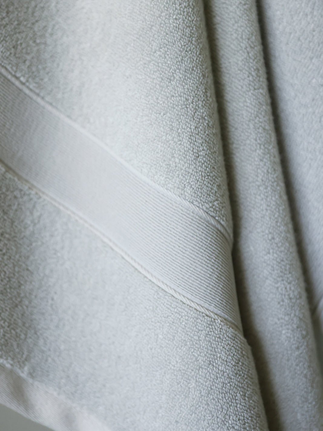 Close up of light grey luxe bath sheet 