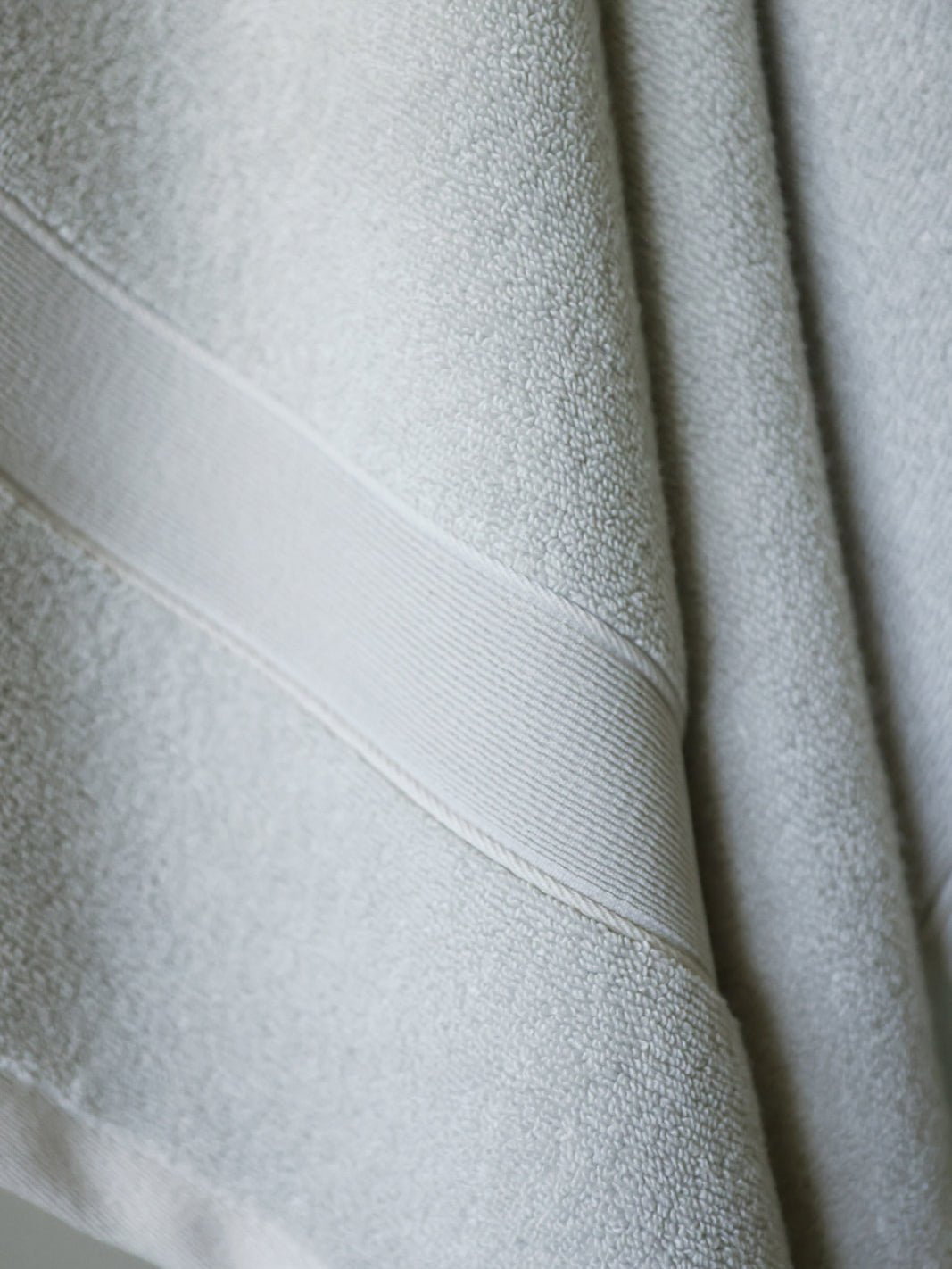 Close up of light grey luxe bath sheet 