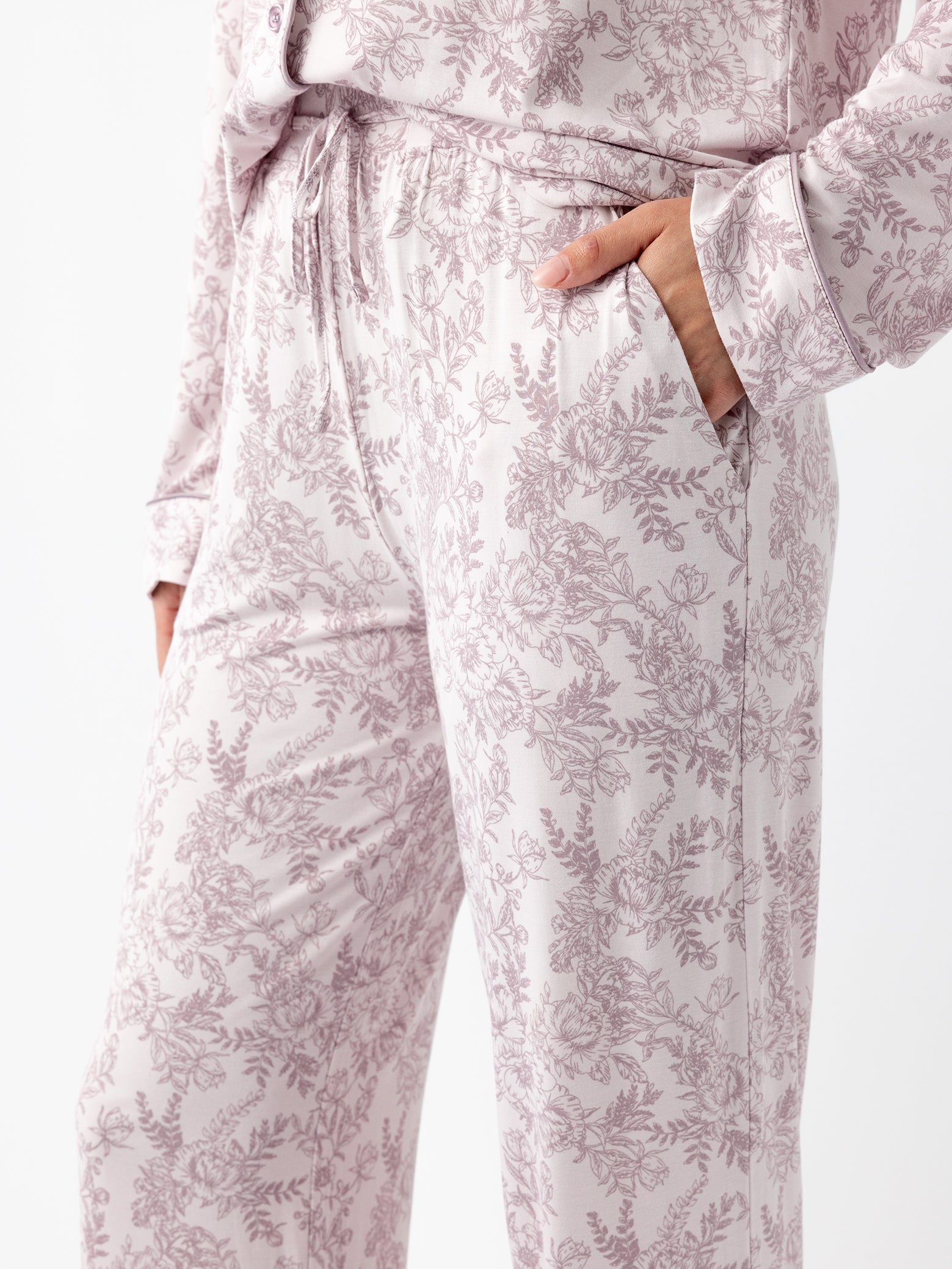 Close up of waist and pocket of lilac toile pajama pants 