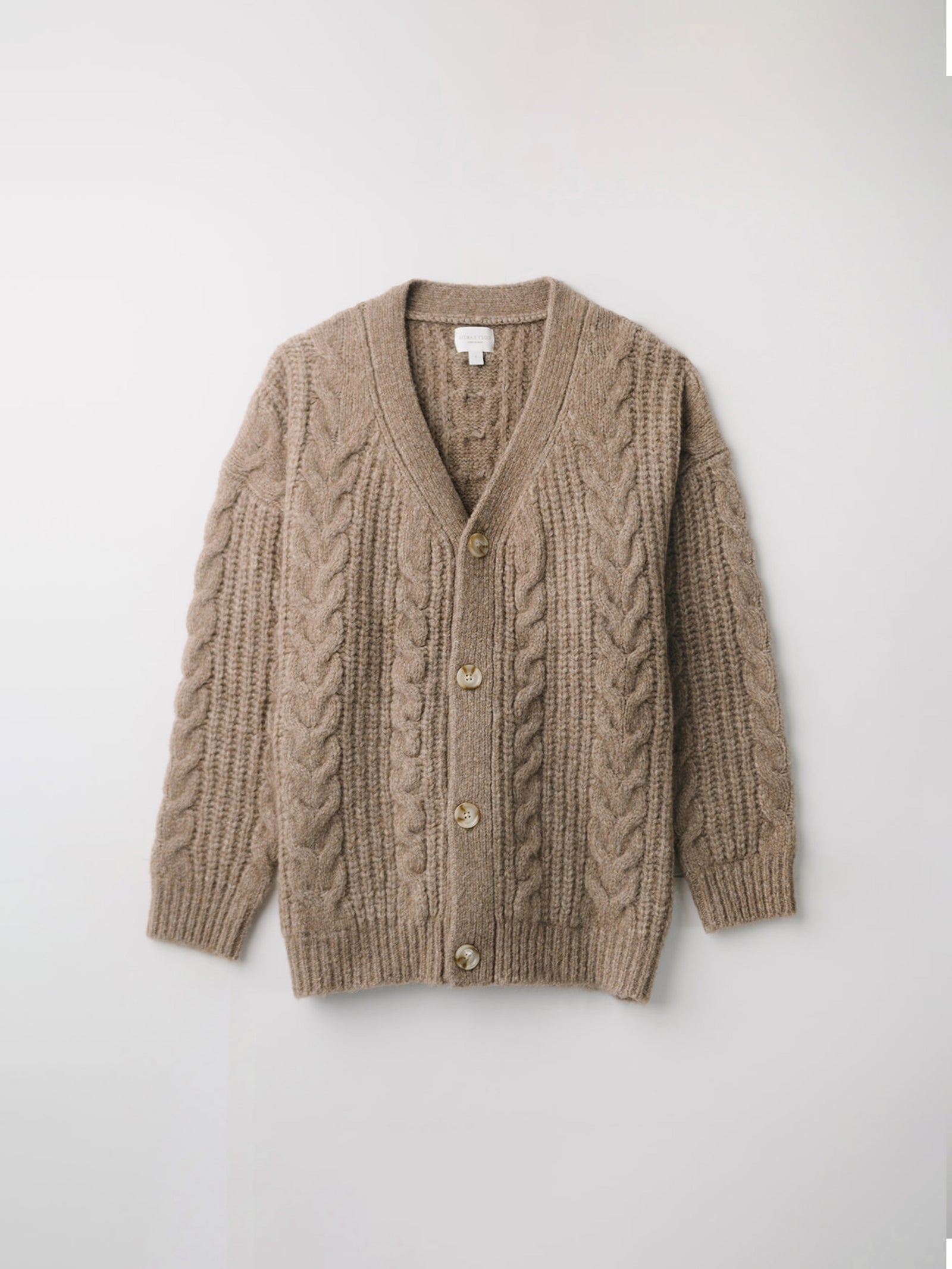 Flat lay of mushroom cable knit cardigan with white background 