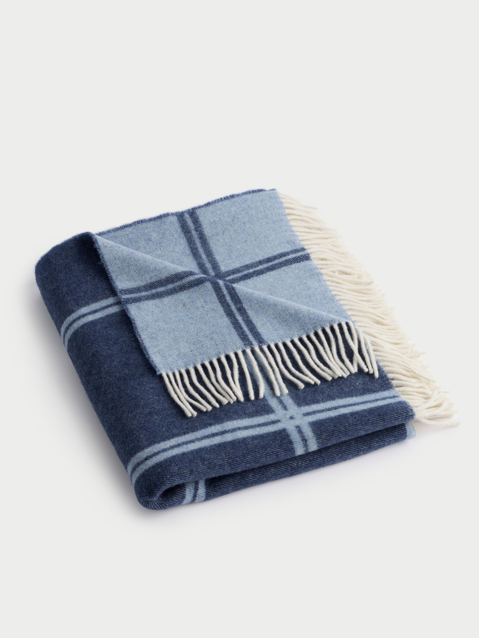 Navy cortina throw folded with white background 