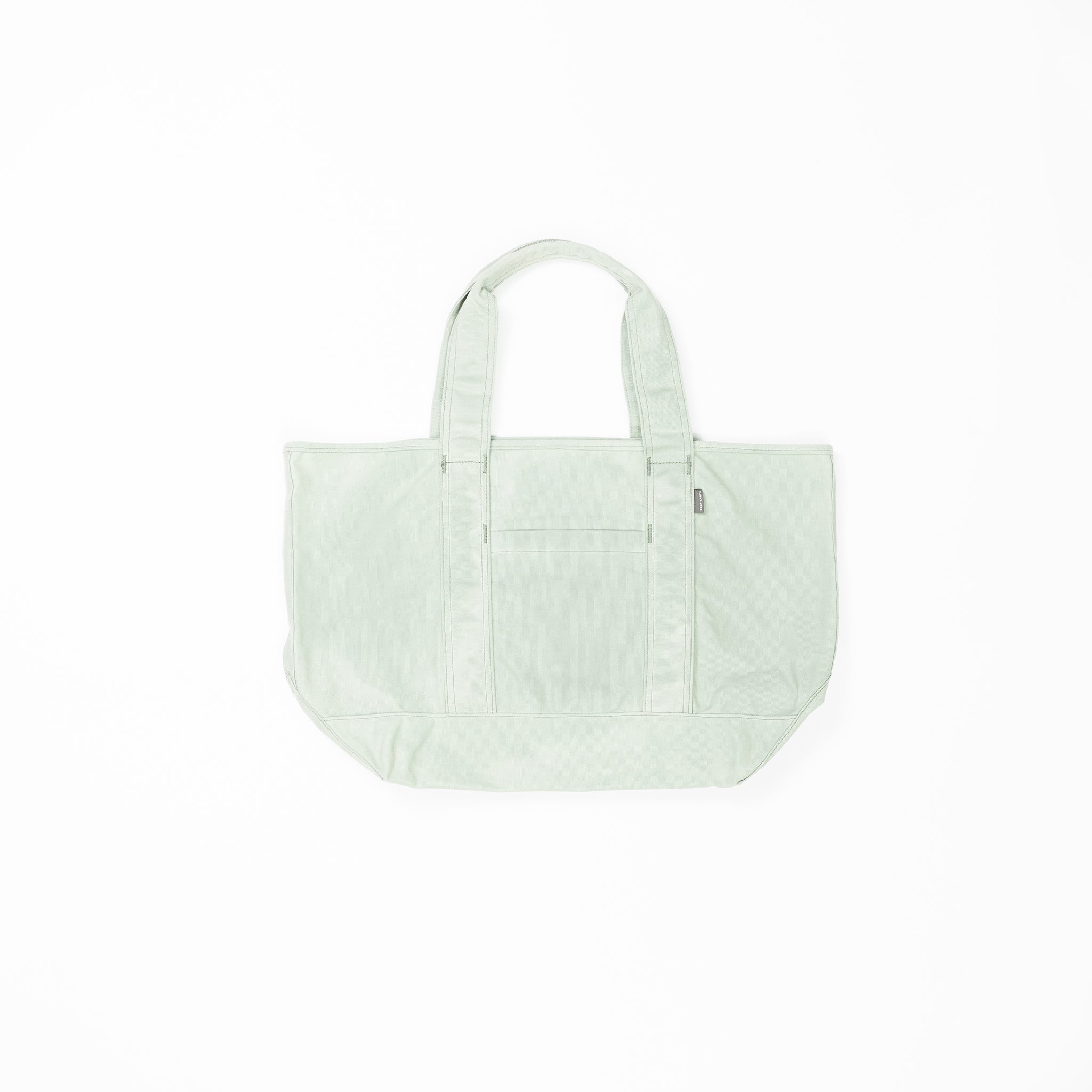 A light green Waxed Canvas Tote from Cozy Earth with two handles is centered on a white background. The tote bag features a front pocket with a zipper, visible seams, and a rectangular shape, providing ample storage space. |Color:Palm