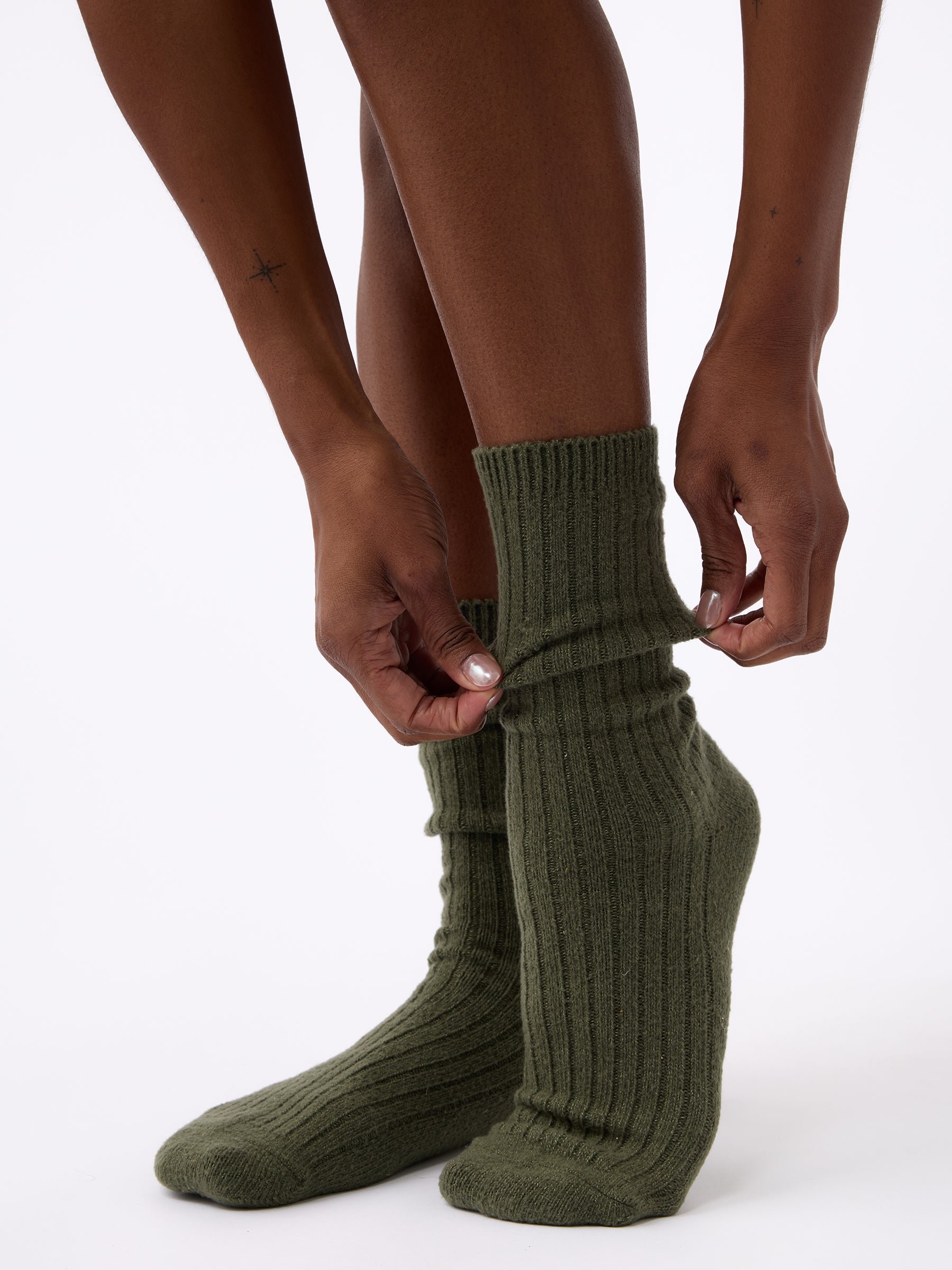 Person wearing Cozy Earth Plush Lounge Sock in Olive 