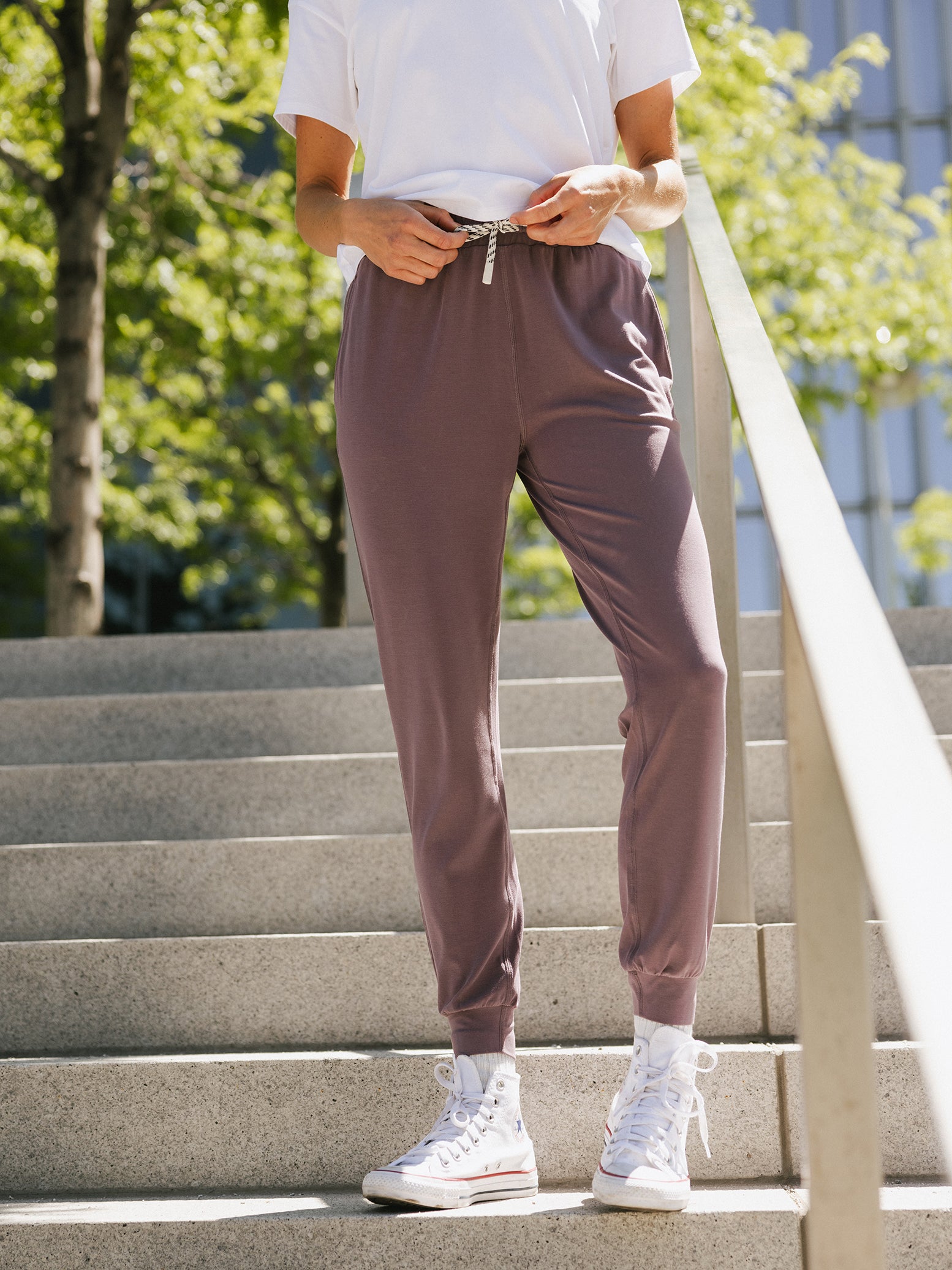 Twilight Studio Jogger. The Studio Joggers are worn by a woman photographed with a city type background. 