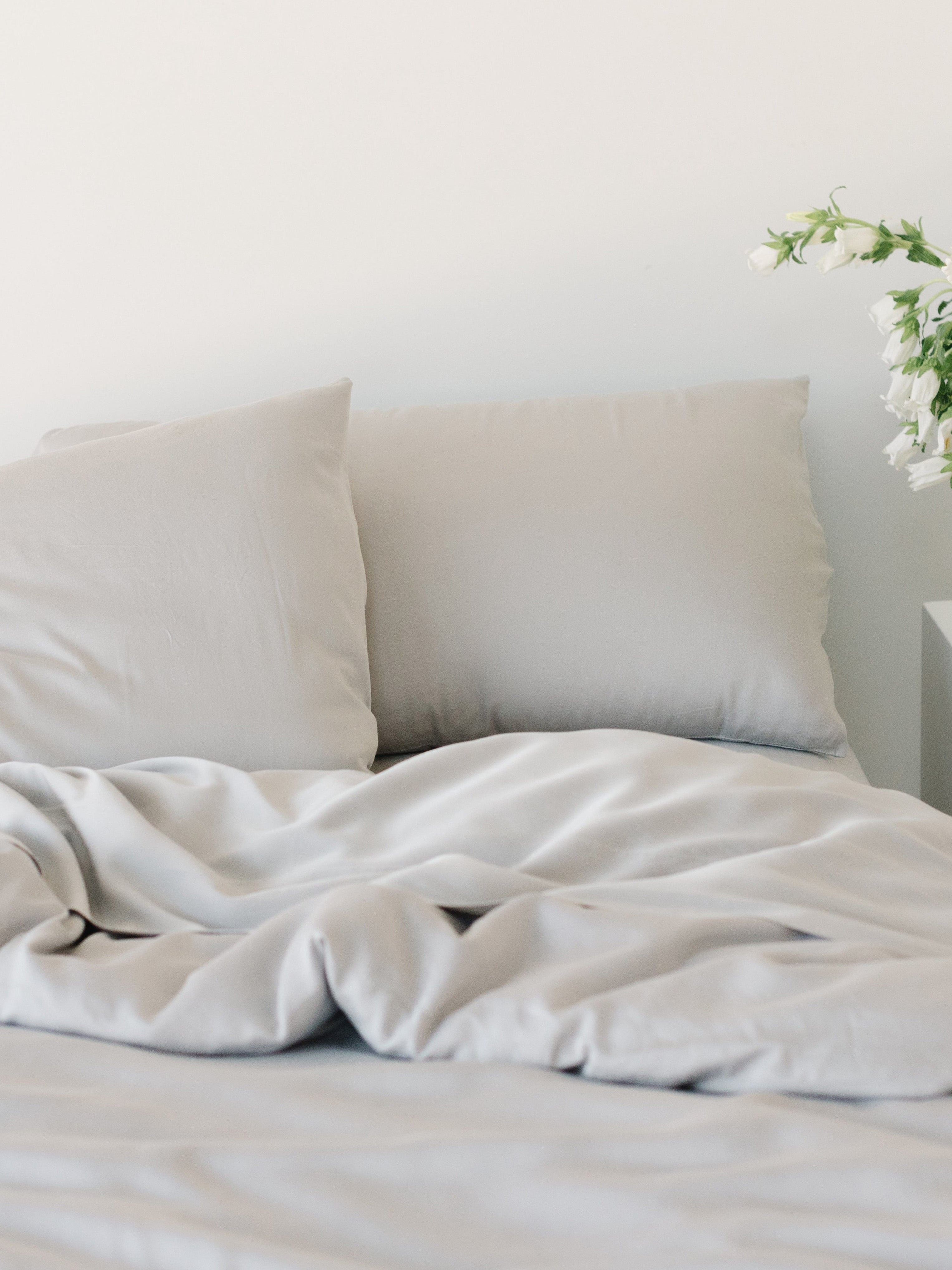 Partially made bed with light grey bedding |Color:Light Grey