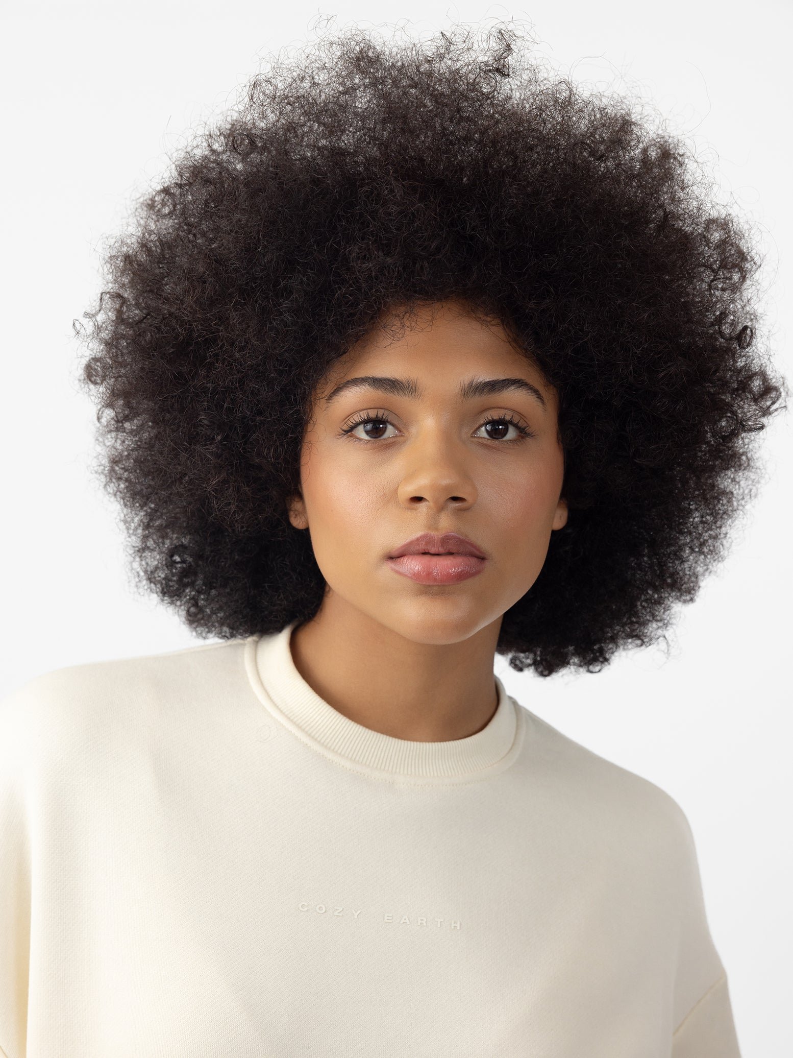 Woman wearing Alabaster CityScape Crewneck with white background 