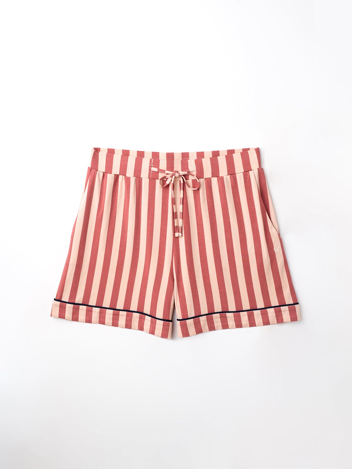 Flat lay of blush stripe pajama shorts with white background 