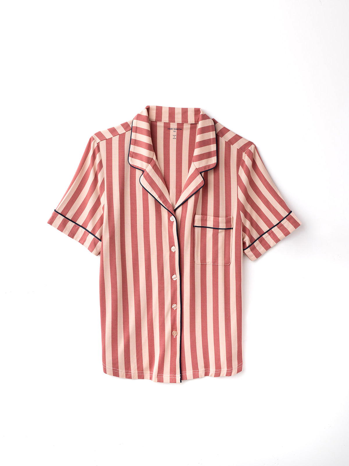 Flat lay of blush stripe short sleeve pajama top with white background 