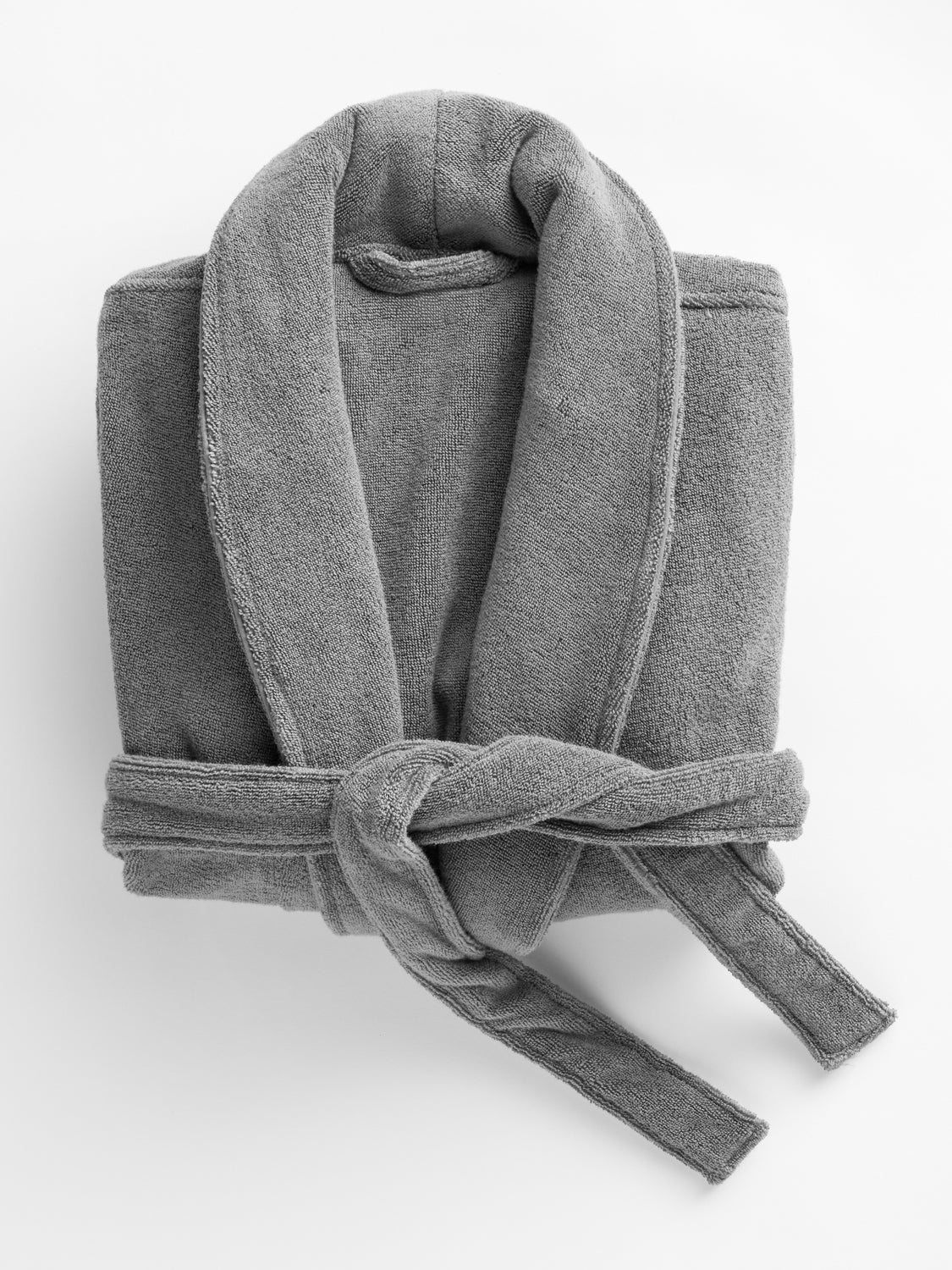 A folded Cozy Earth Luxe Bath Robe in Charcoal is shown on a white background. 