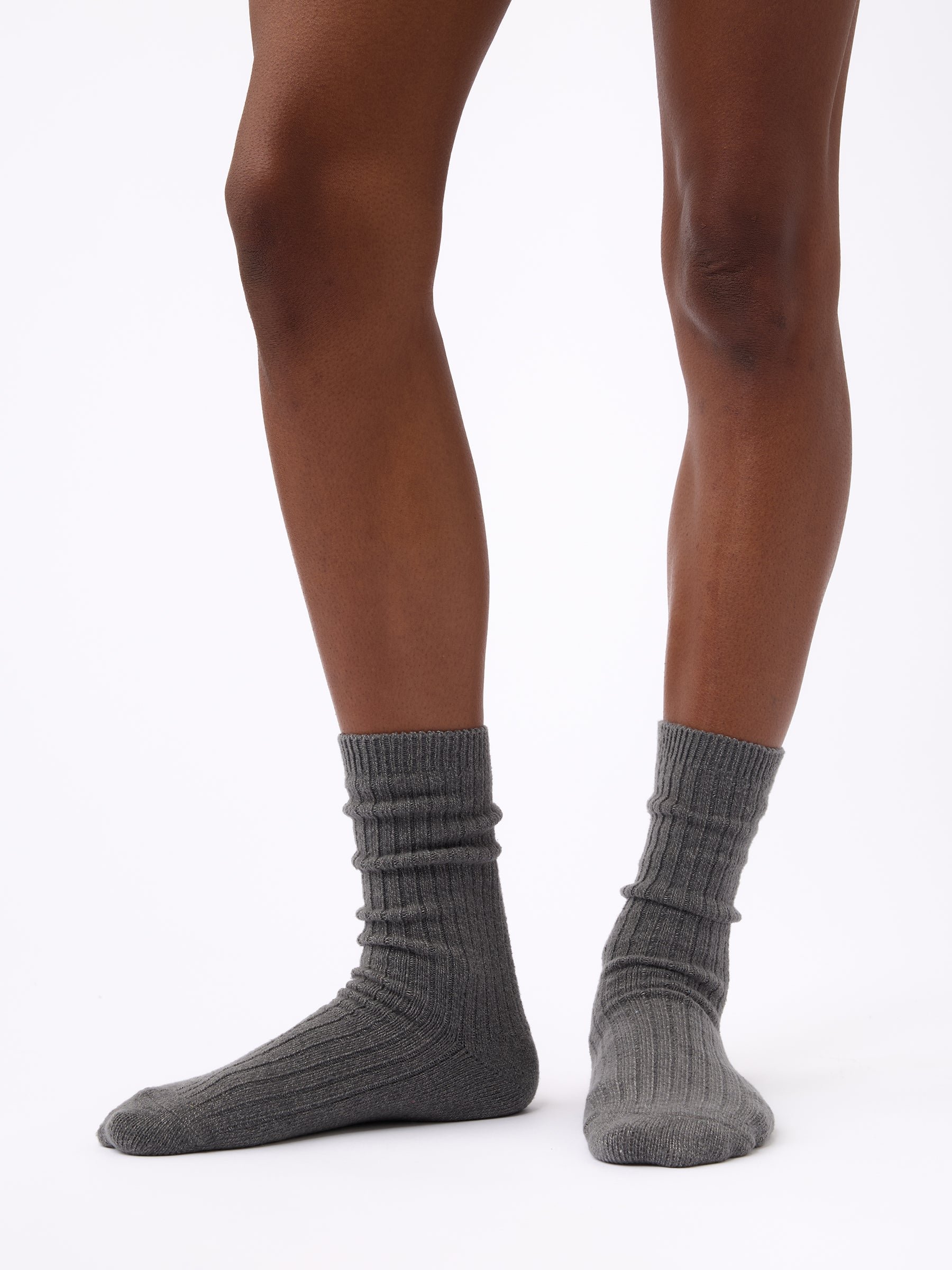 Person wearing Cozy Earth Plush Lounge Sock in Coal 