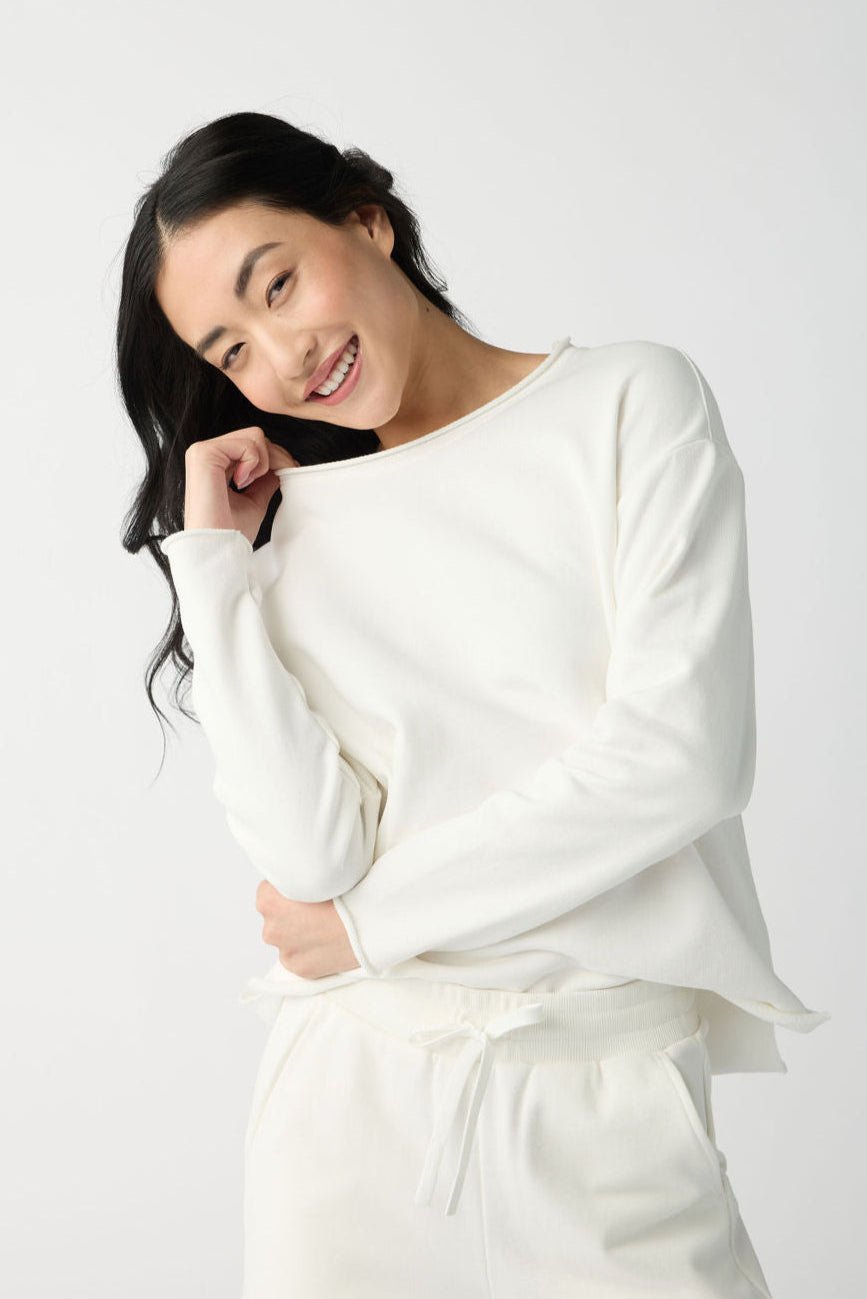 A dark haired woman wears Cozy Earth Women's Chelsea Pullover in Bone. |Color:Bone