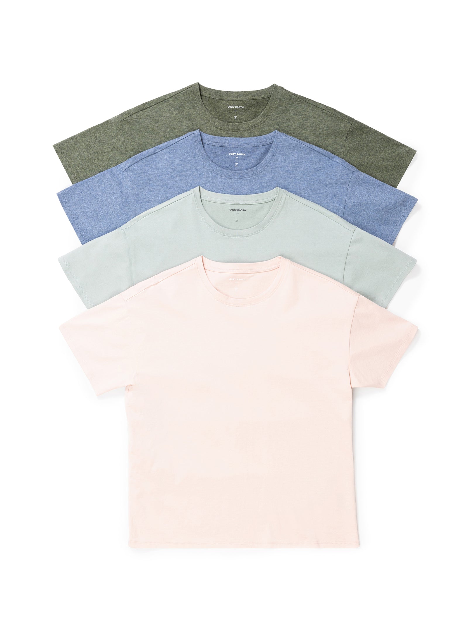 The Women's All Day Tee by Cozy Earth, featuring four neatly stacked, plain T-shirts in different colors: green, blue, light green, and off-white, arranged from top to bottom. These short-sleeved shirts boast a simple, minimalist design. 