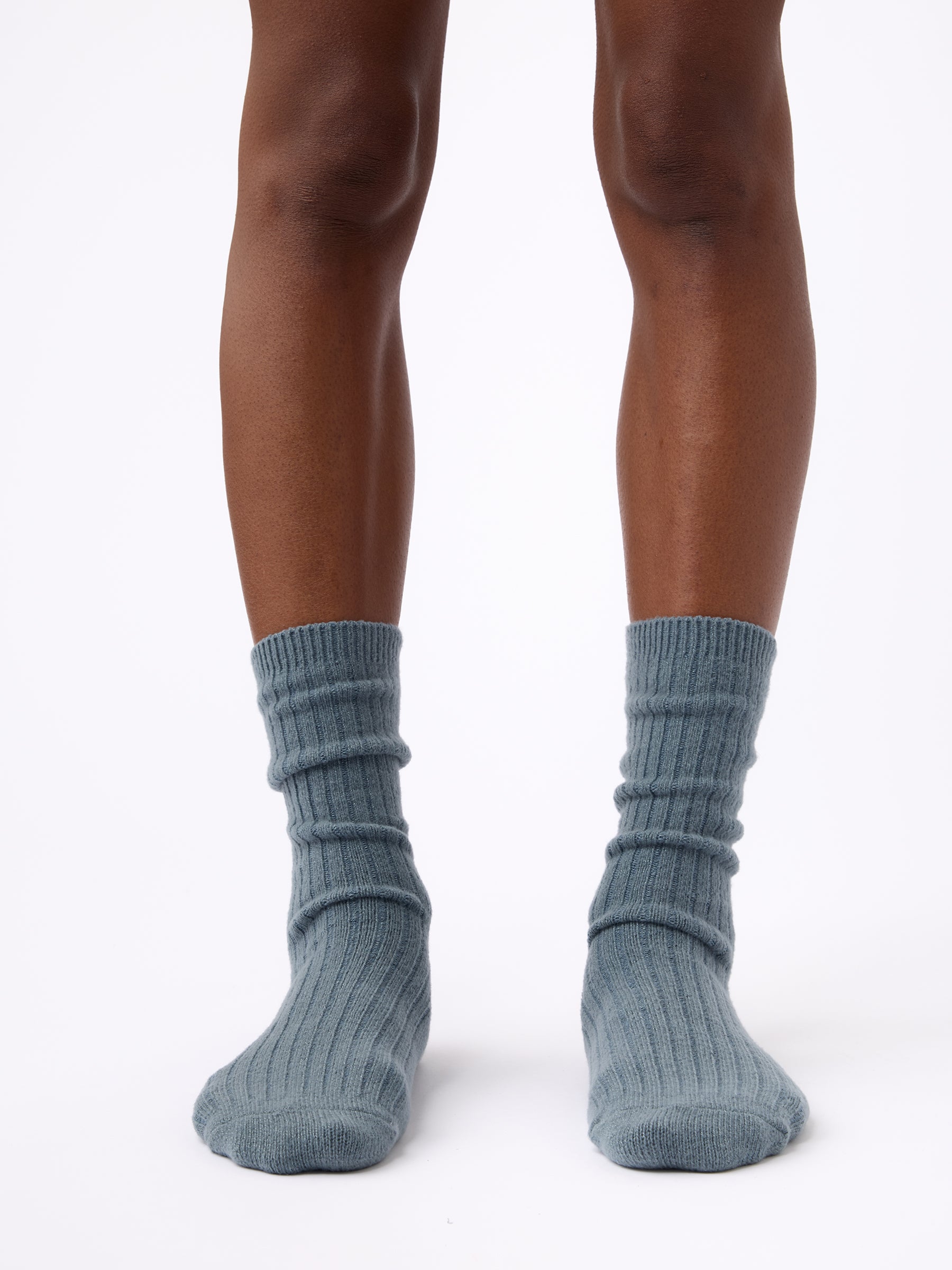 Person wearing Cozy Earth Plush Lounge Sock in Deep Blue |Color:Eclipse/Deep Blue/Smokey Blue