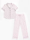 The Women's Bamboo Stretch-Knit Pajama Set by Cozy Earth includes a light pink short-sleeved, button-up top with a small pocket and matching long pants. Both pieces feature a subtle feather print and dark piping. |Color:French Lavender