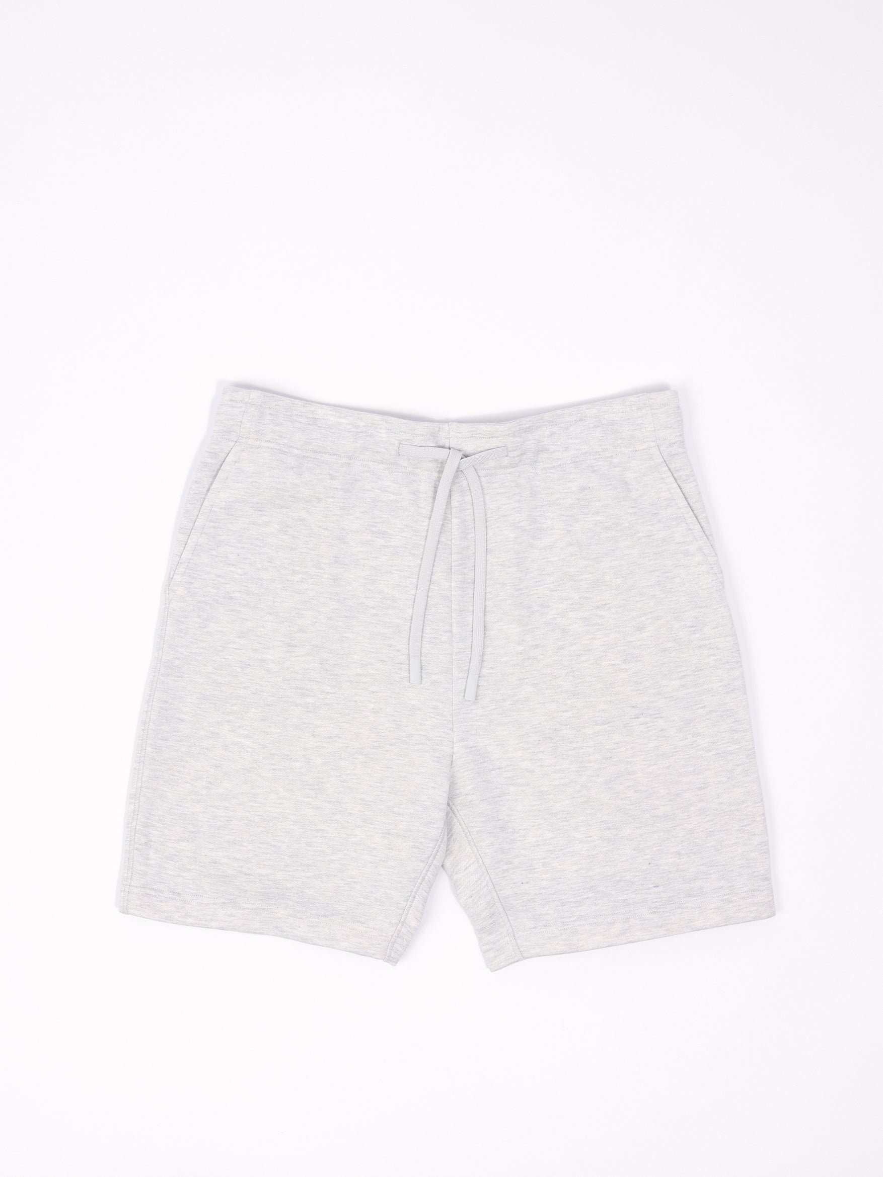 Flat lay of heather grey cityscape shorts with white background 