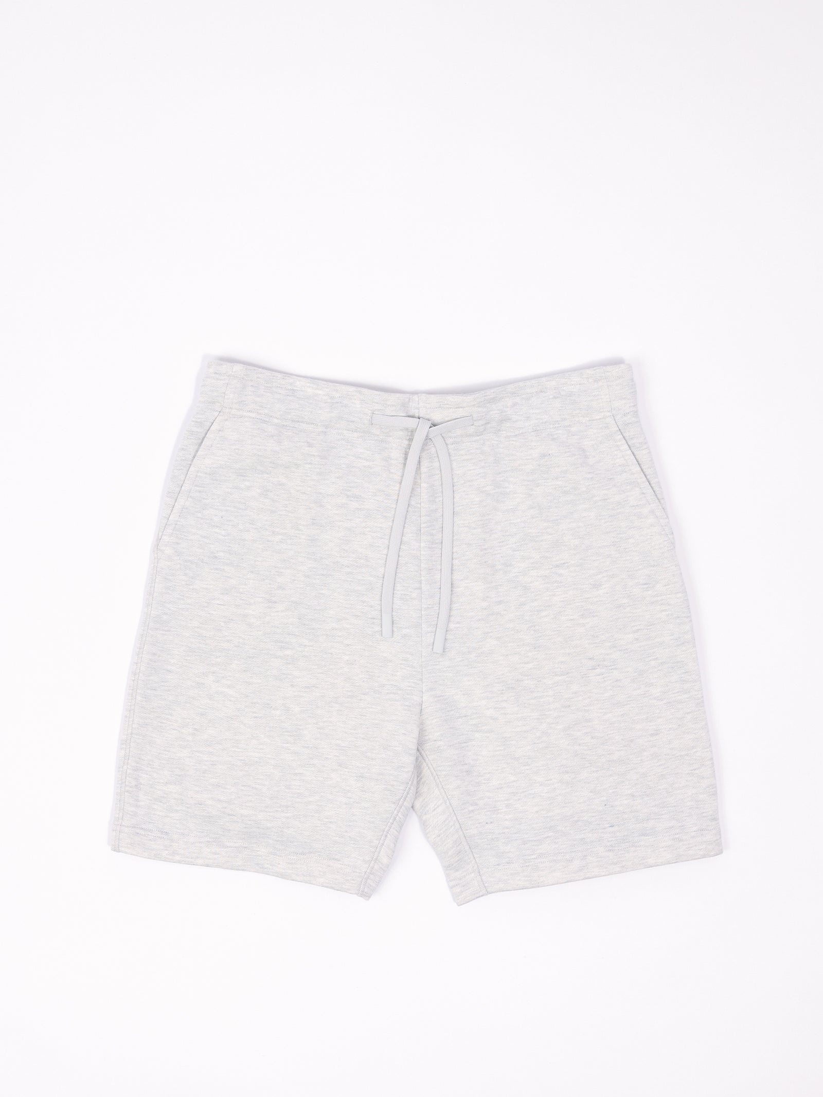 Flat lay of heather grey cityscape shorts with white background 