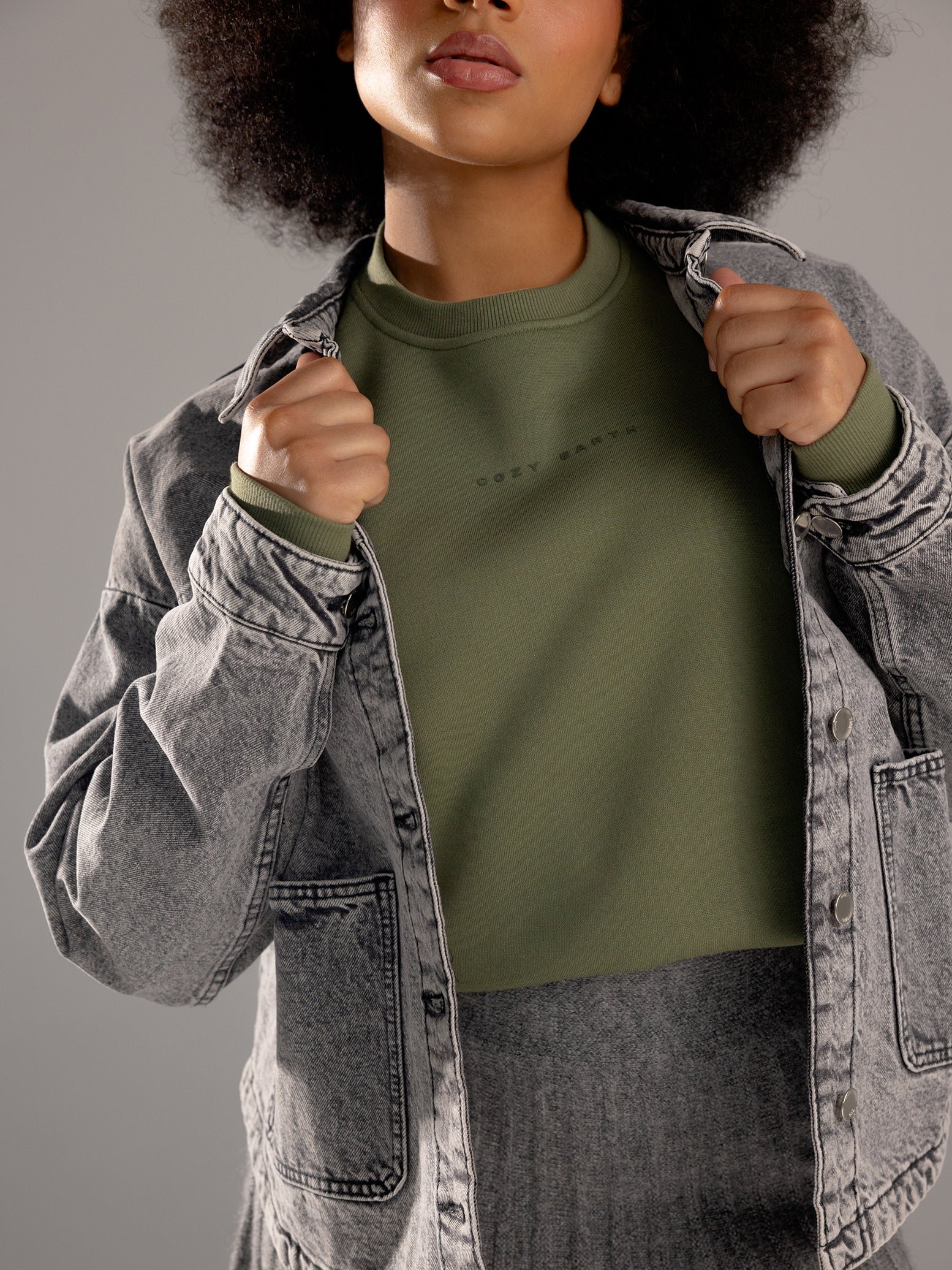 Woman wearing Juniper CityScape Crewneck with grey background 