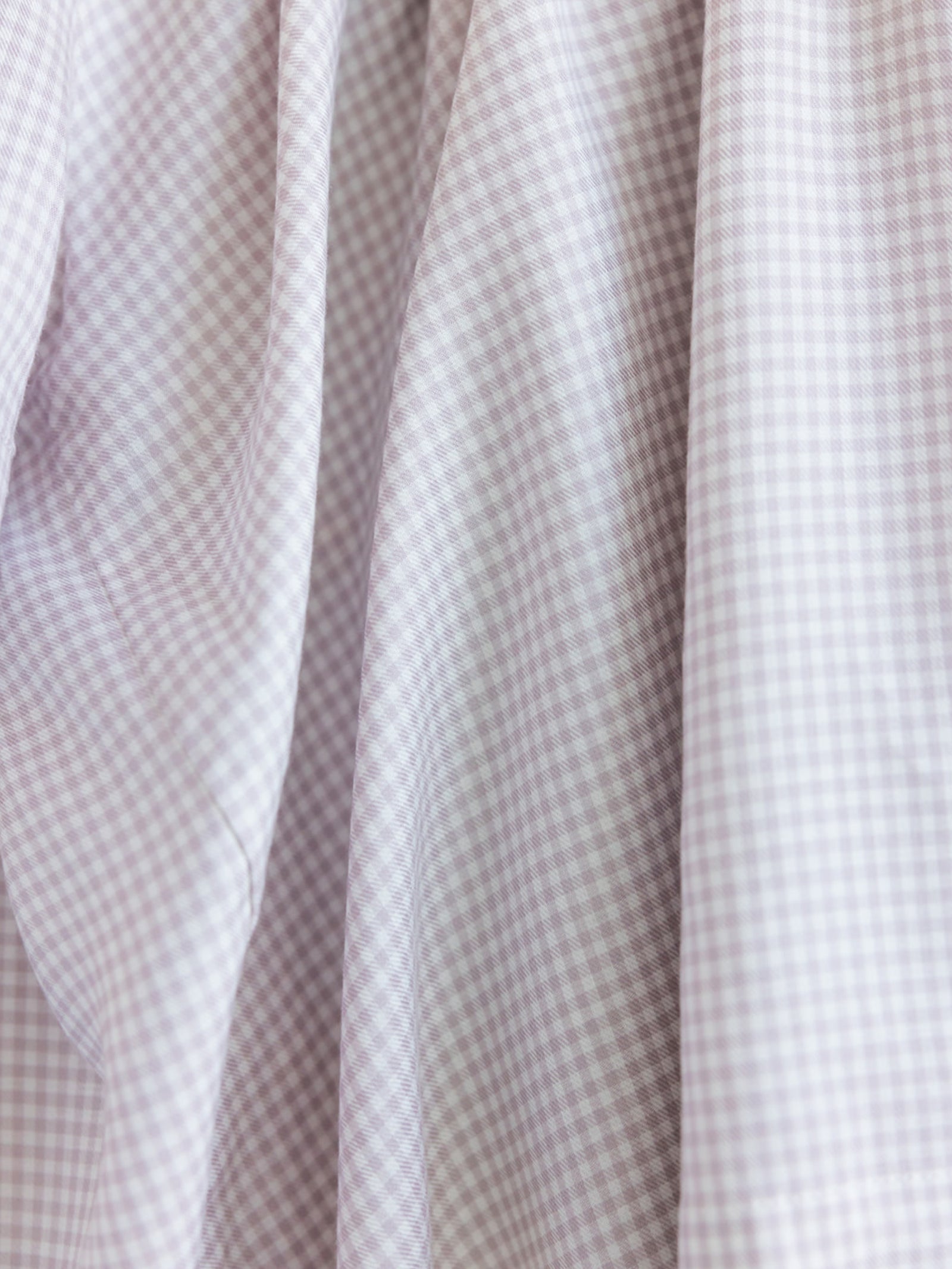 Close up of lavender mini gingham pajama fabric 