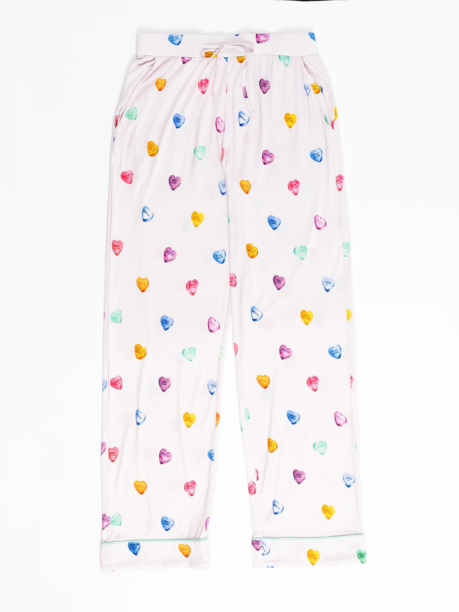 Cozy Earth's Women's Stretch-Knit Long Sleeve Bamboo Pajama Set features white pajama pants adorned with pink, blue, orange, purple, and yellow hearts. They include an elastic waistband with a drawstring for an adjustable fit and plain cuffs. 