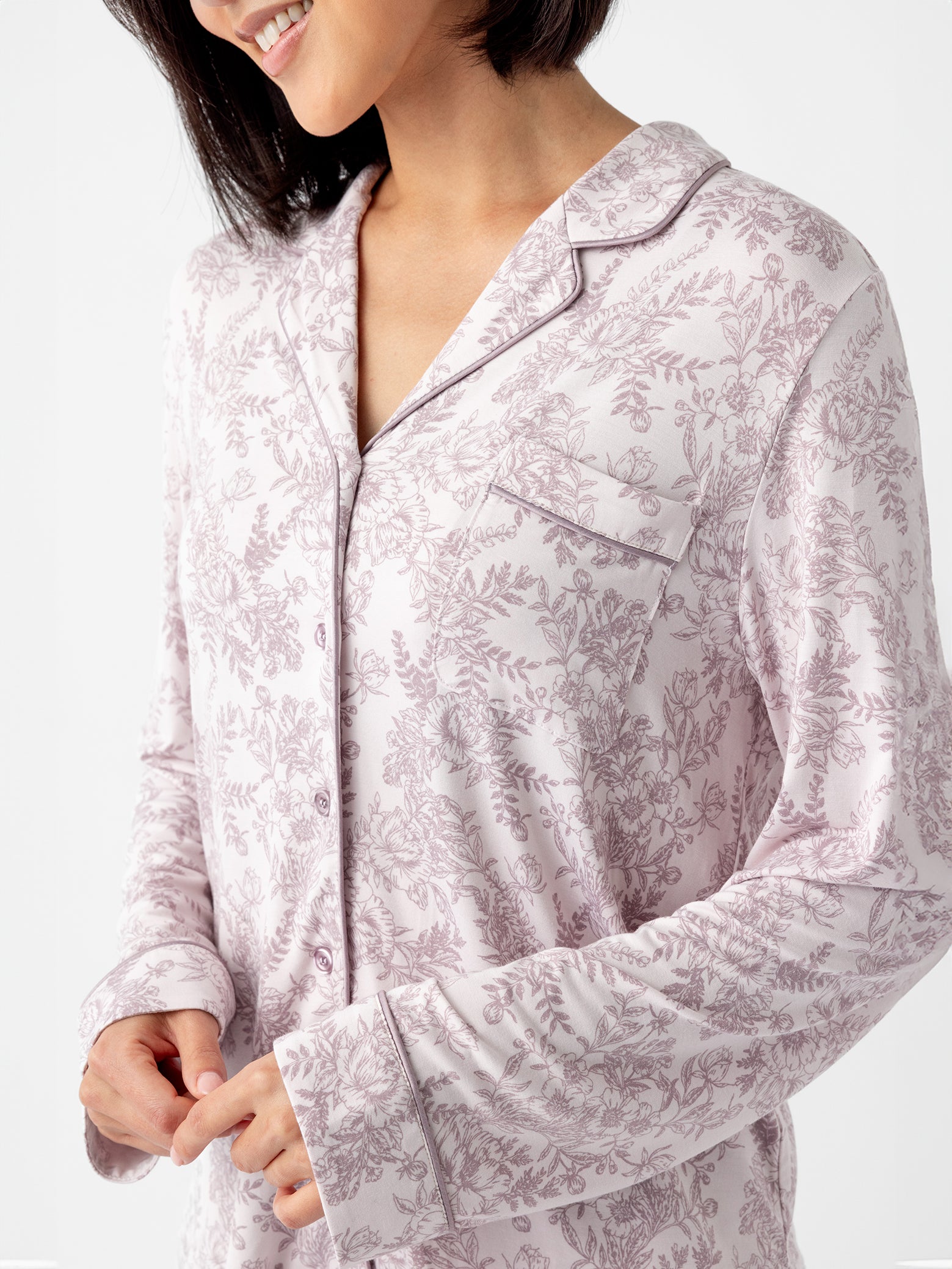 Close up of woman wearing lilac toile pajama shirt 