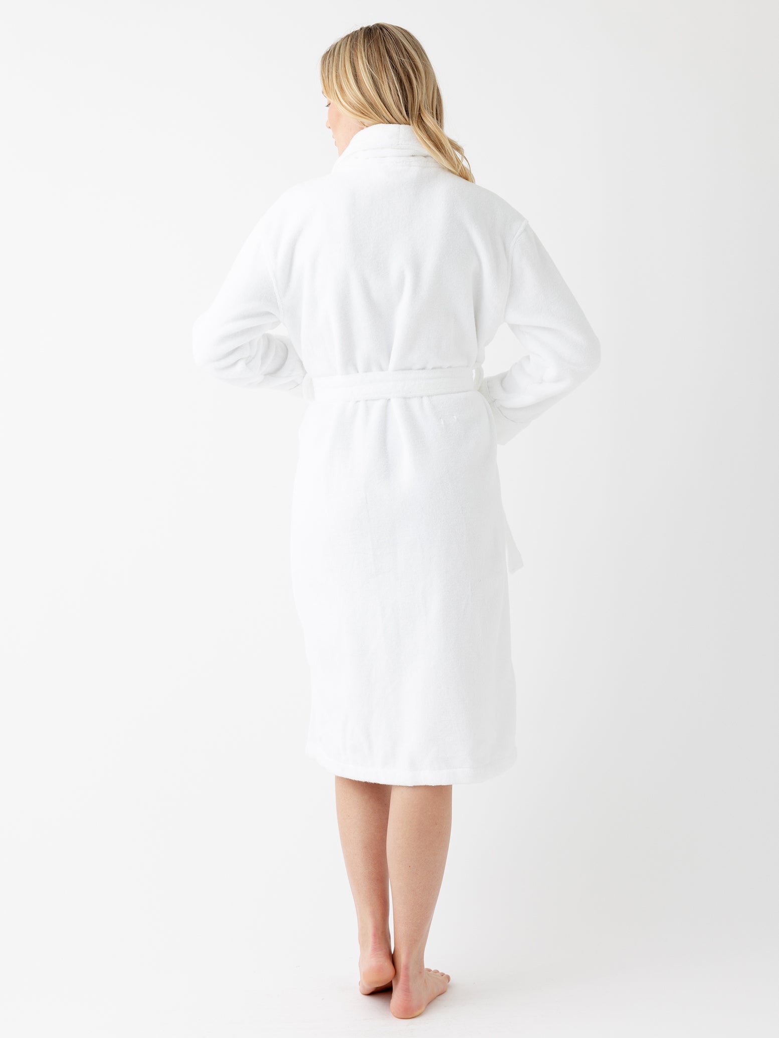 Back of woman with white bath robe 