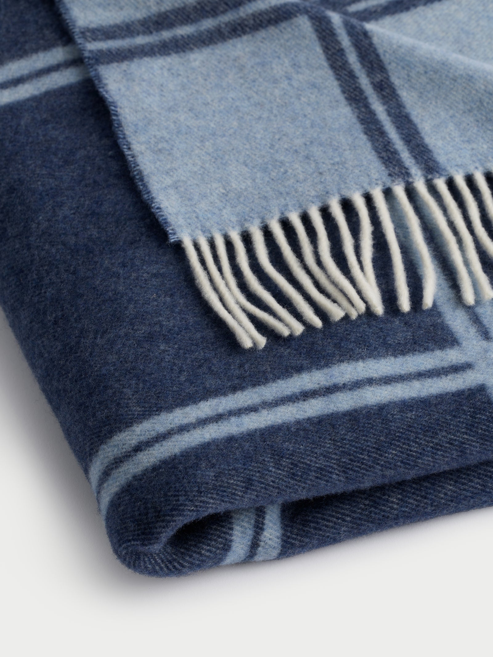 Close up of folded navy cortina throw 