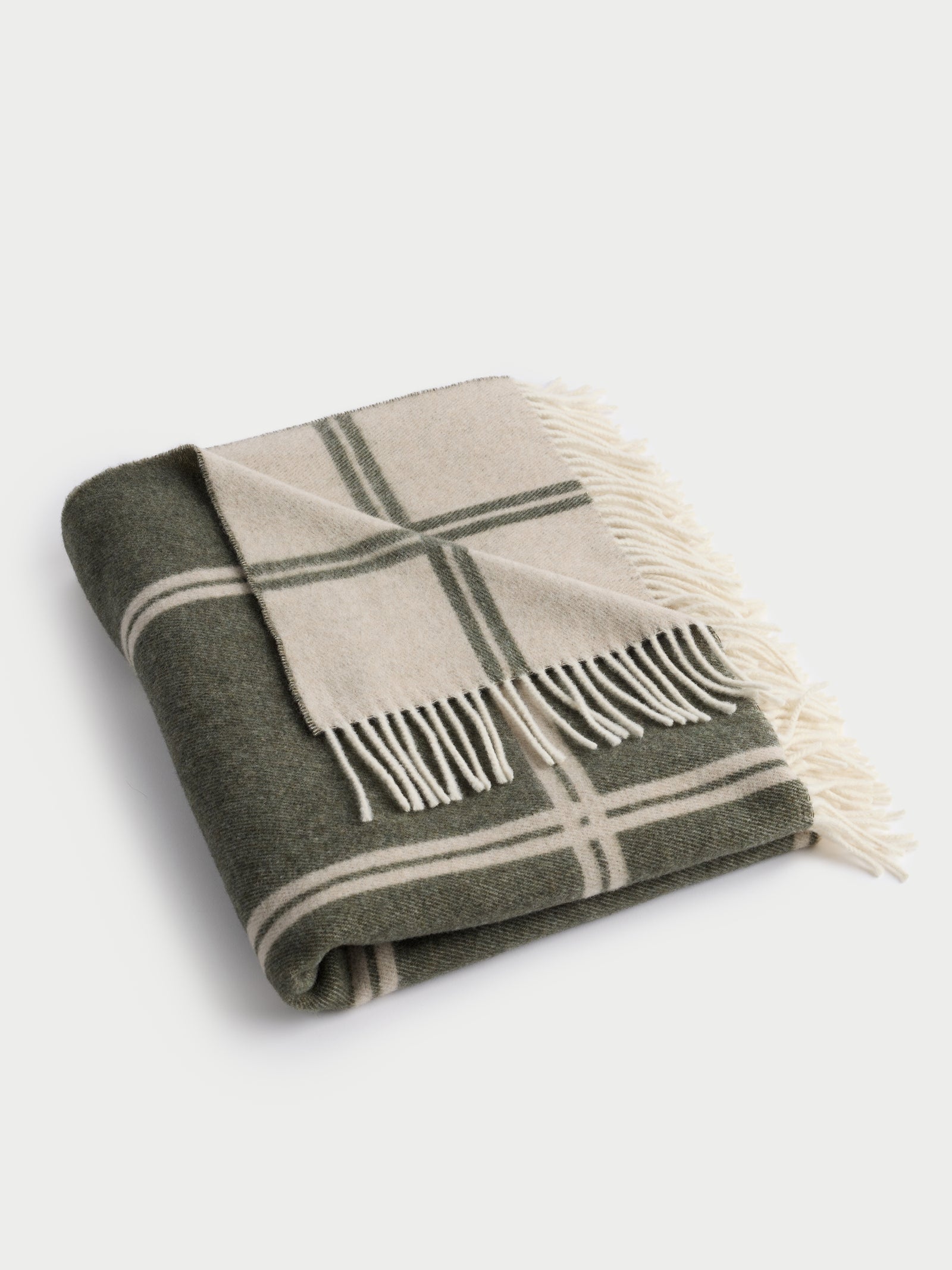 Olive cortina throw folded with white background 