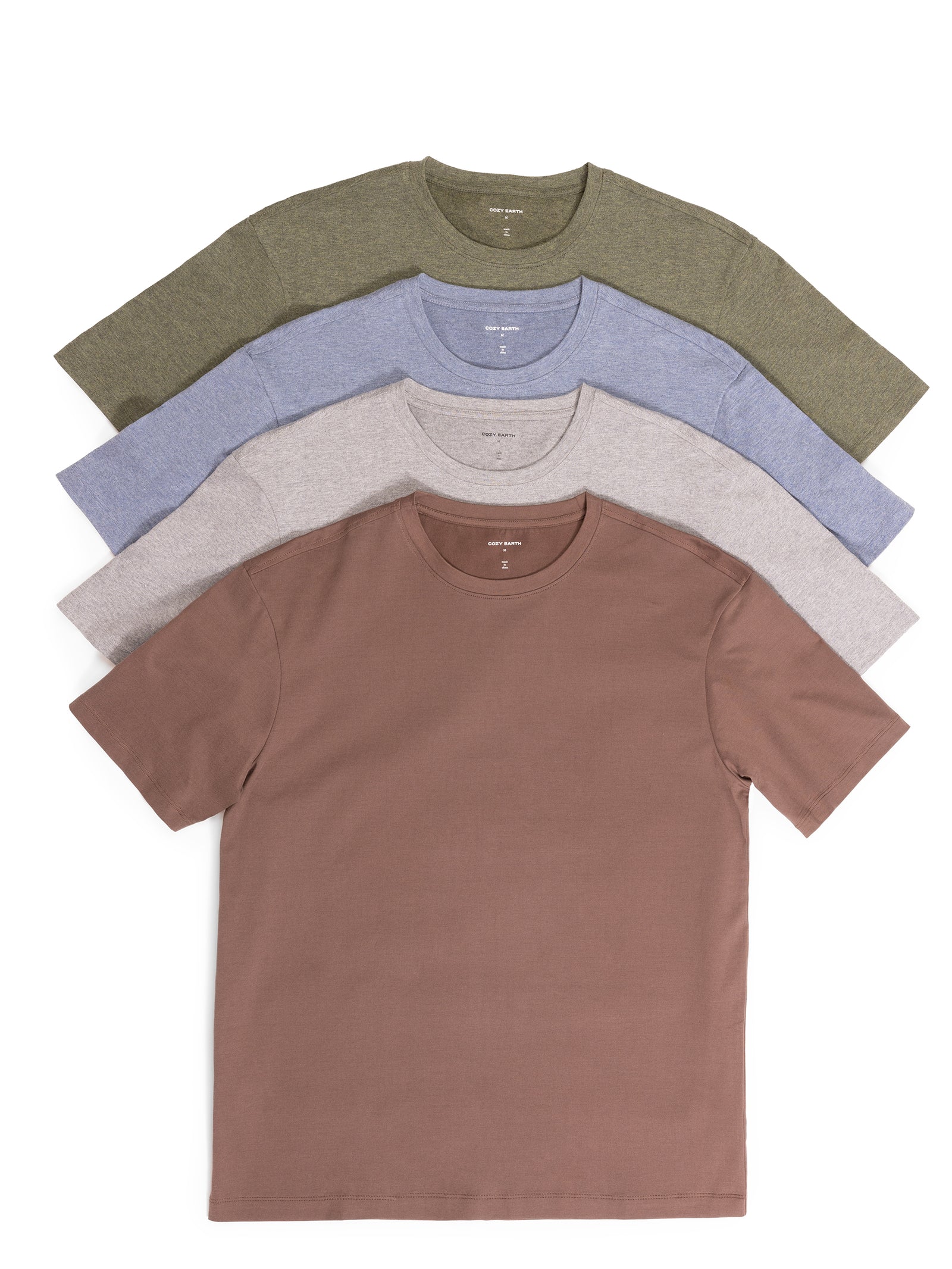 A set of four neatly folded Men's All Day Tee shirts by Cozy Earth in different colors: olive green, light blue, light gray, and brown, arranged in a fan shape against a white background. 