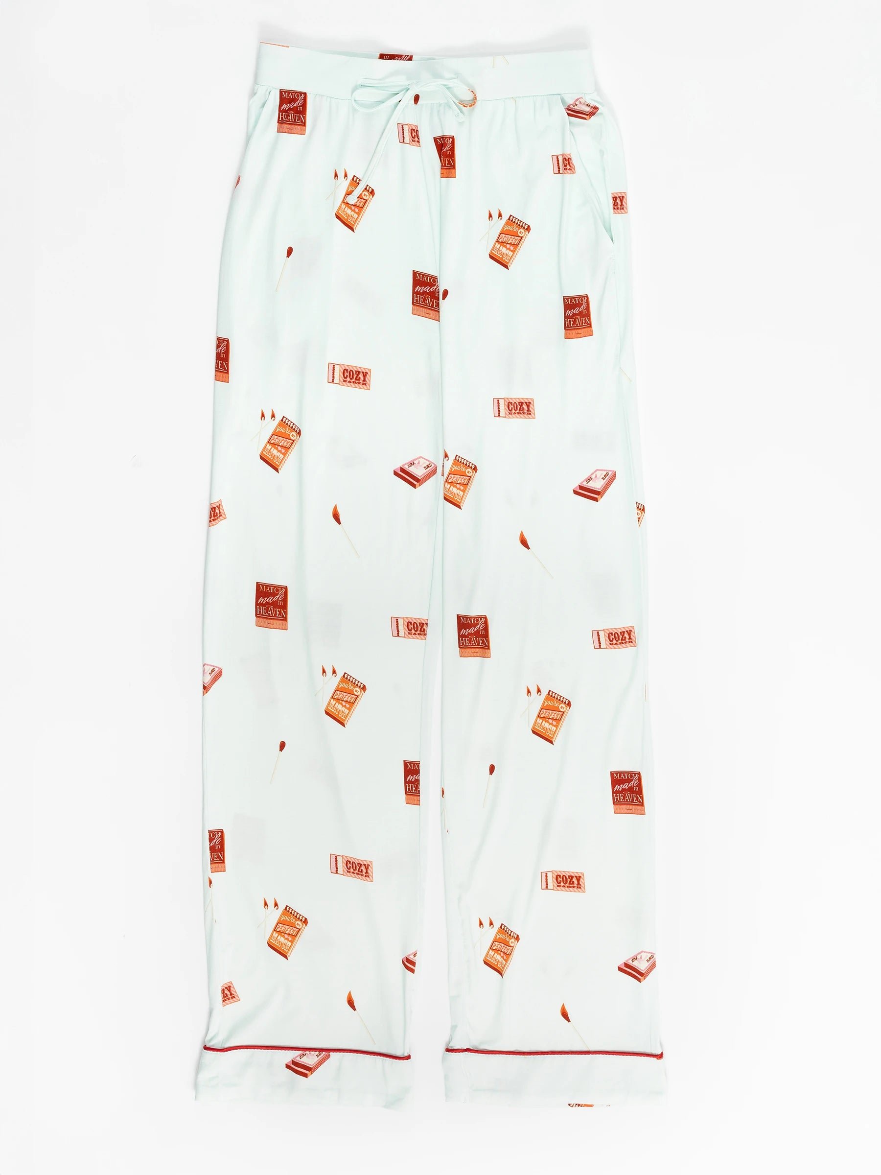 Light blue bamboo stretch-knit pajama pants from Cozy Earth's Last Chance Women's set, featuring a drawstring waist and printed brown and red books with "I Spy," complete with red piping on the cuffs. 