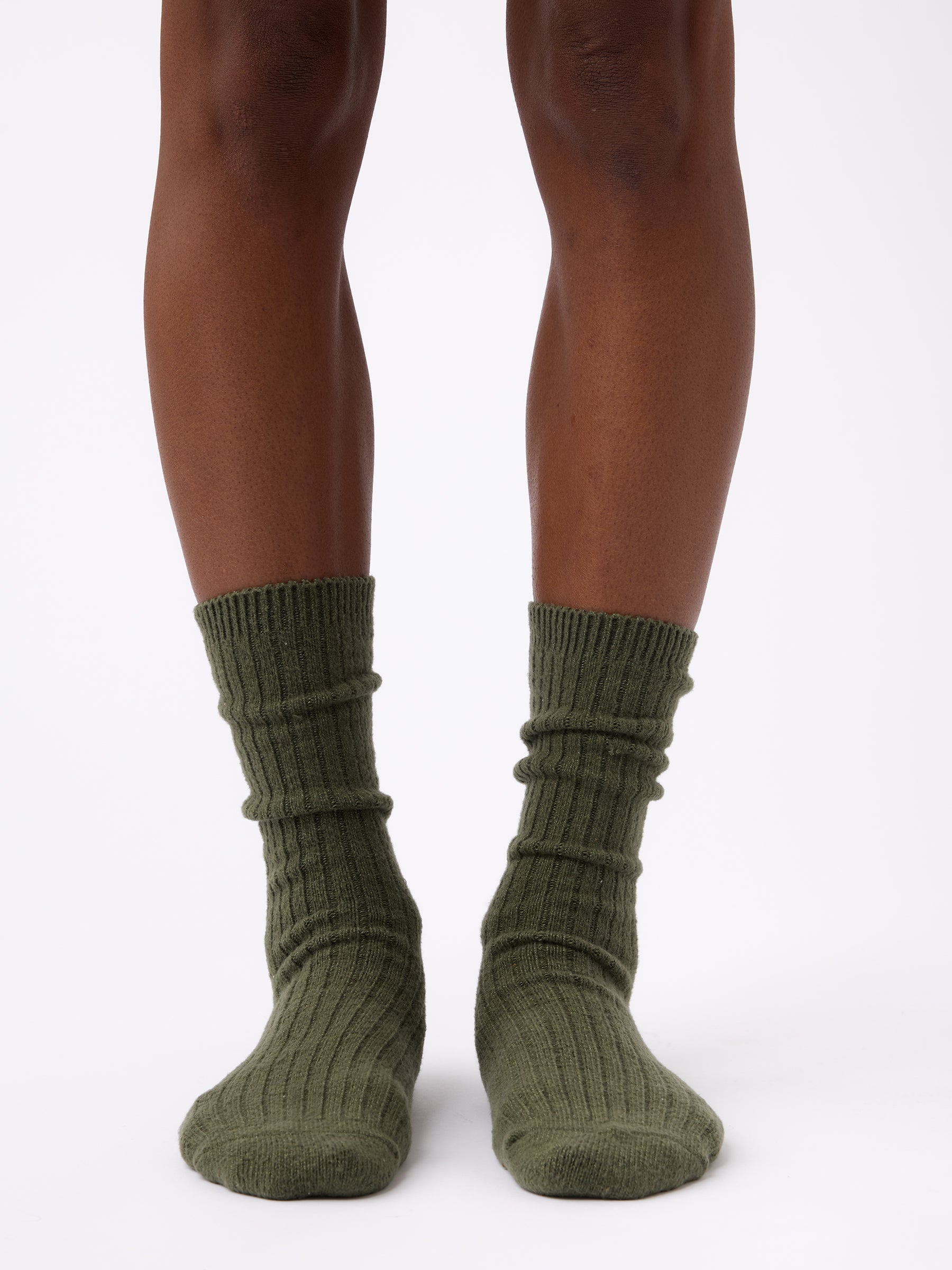 Person wearing Cozy Earth Plush Lounge Calf Sock in Olive 
