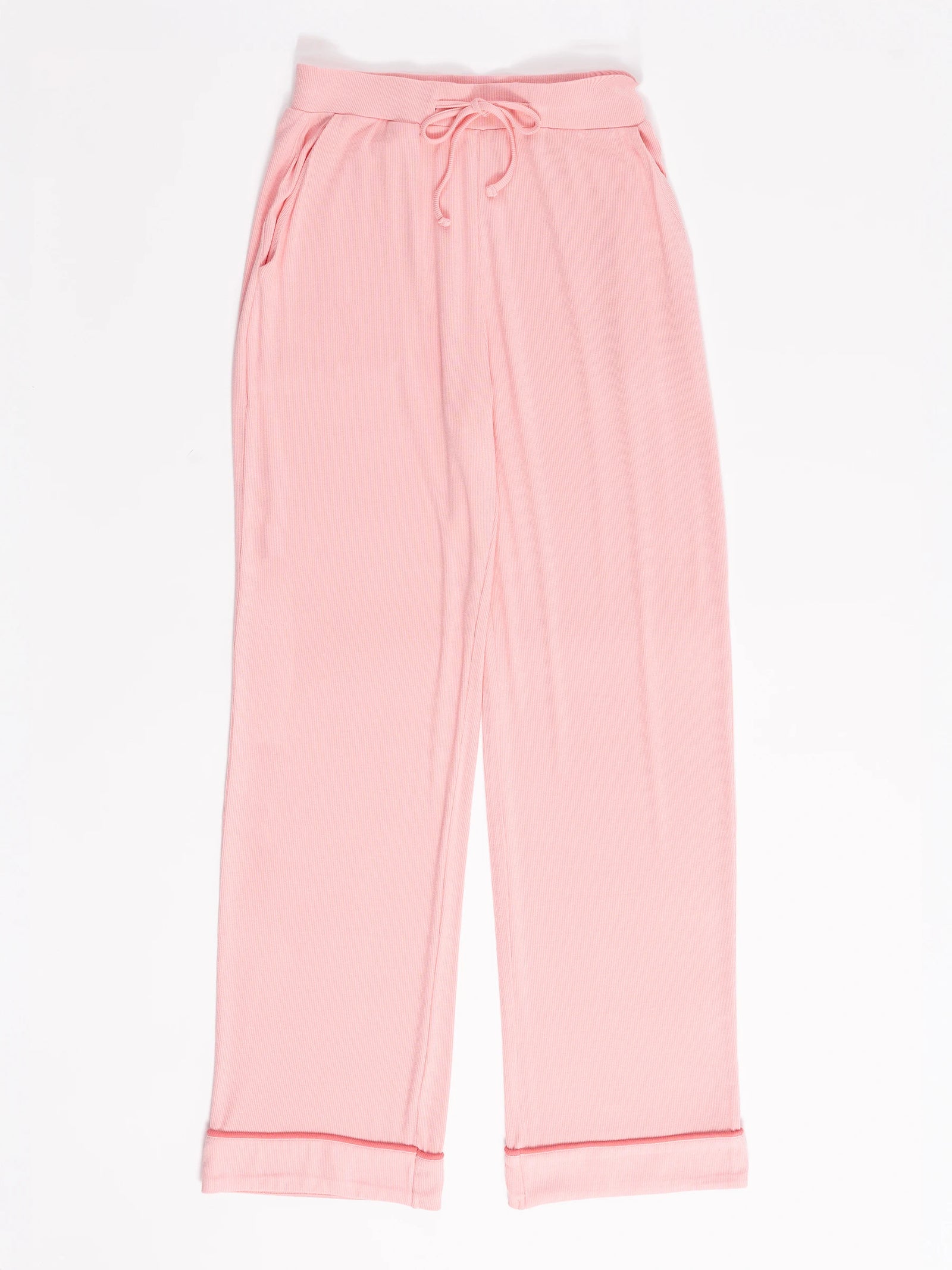 Women's Bamboo Rib-Knit Classic Pajama Pant by Cozy Earth: Relaxed-fit pink lounge pants with cuffed hems, drawstring waist, and side pockets, set against a white background. 