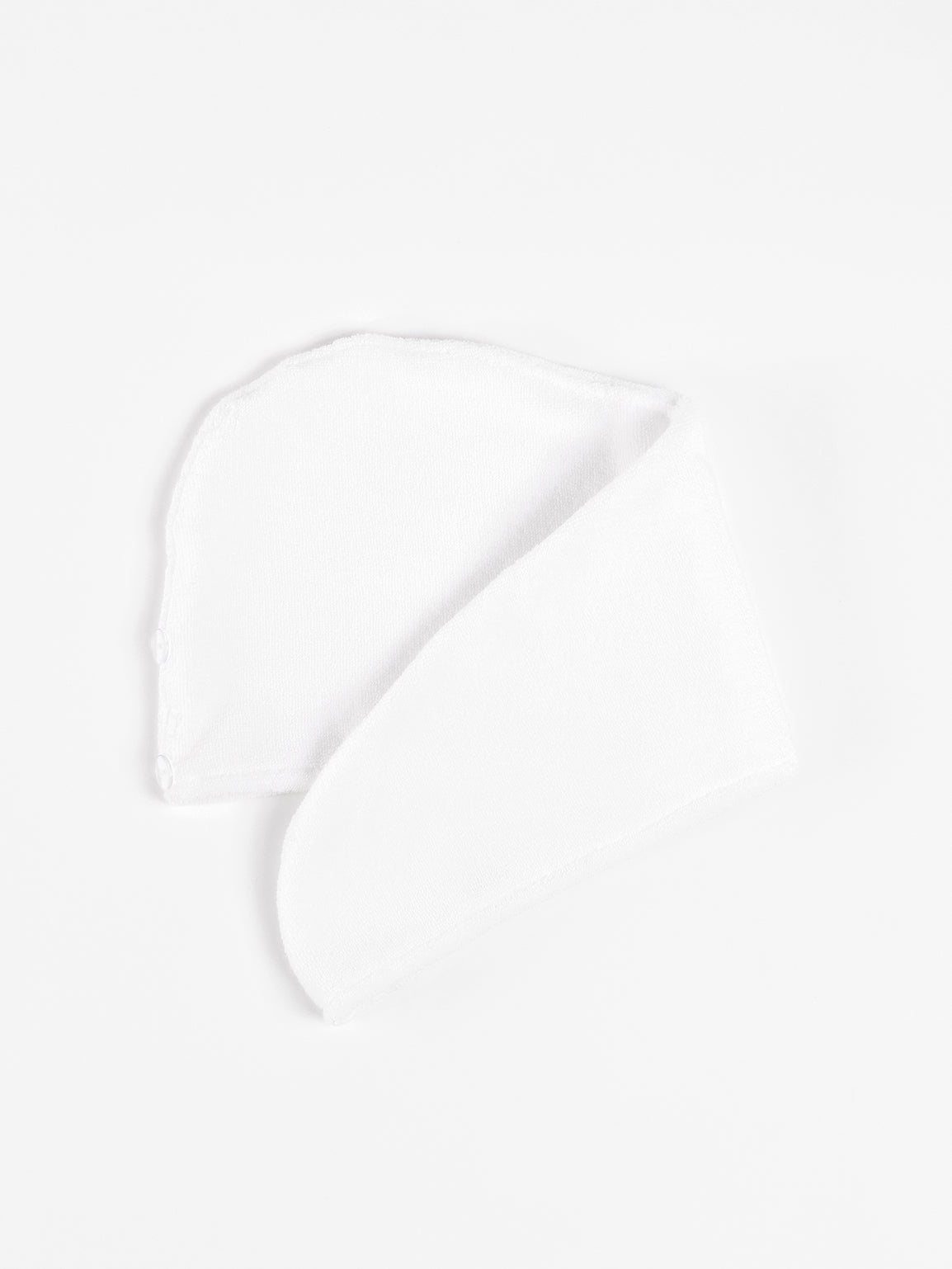 Flat lay of white hair towel with white background 
