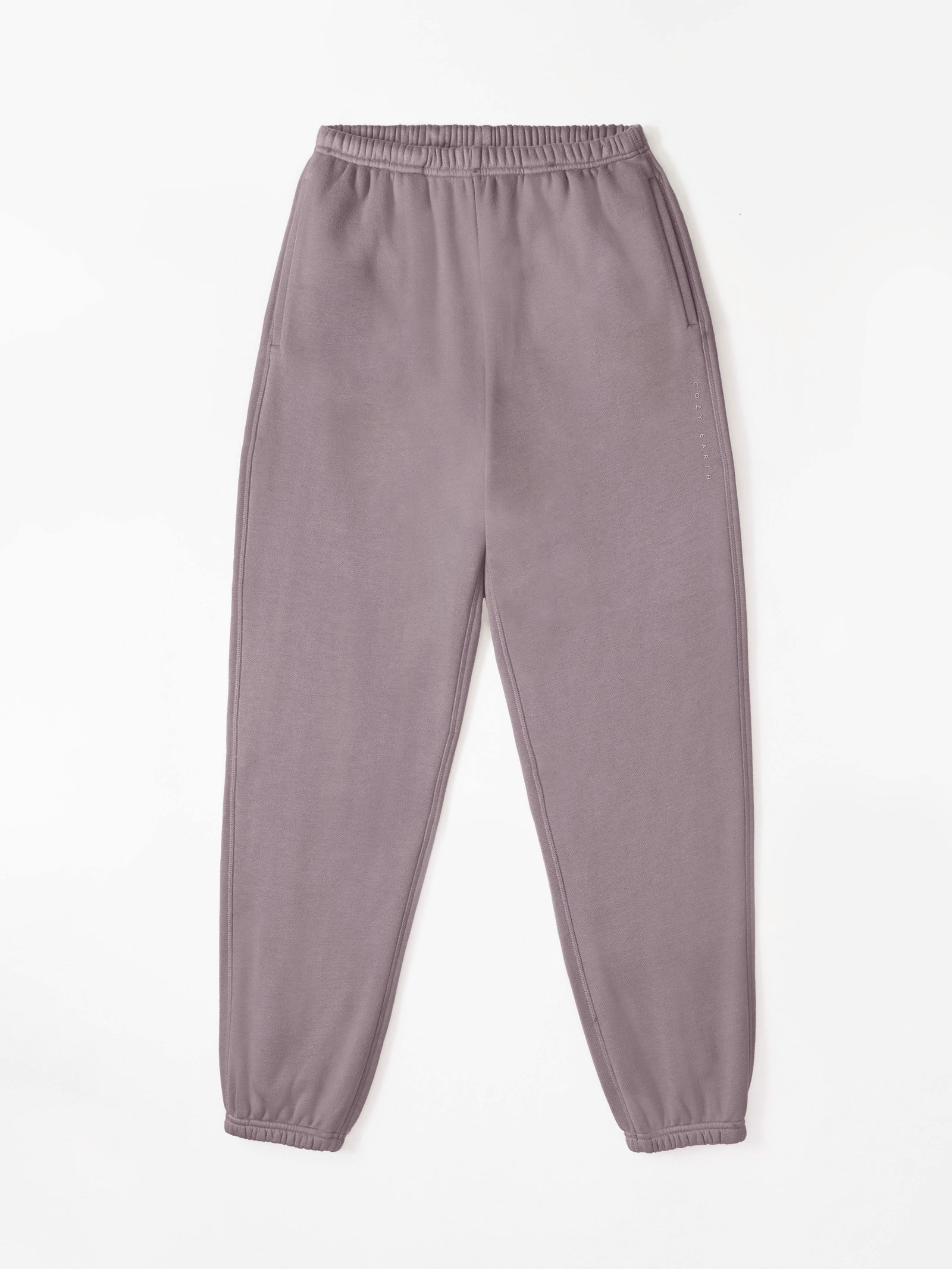 Dusty Orchid CityScape Joggers. The Joggers are laying flat over a white background. 