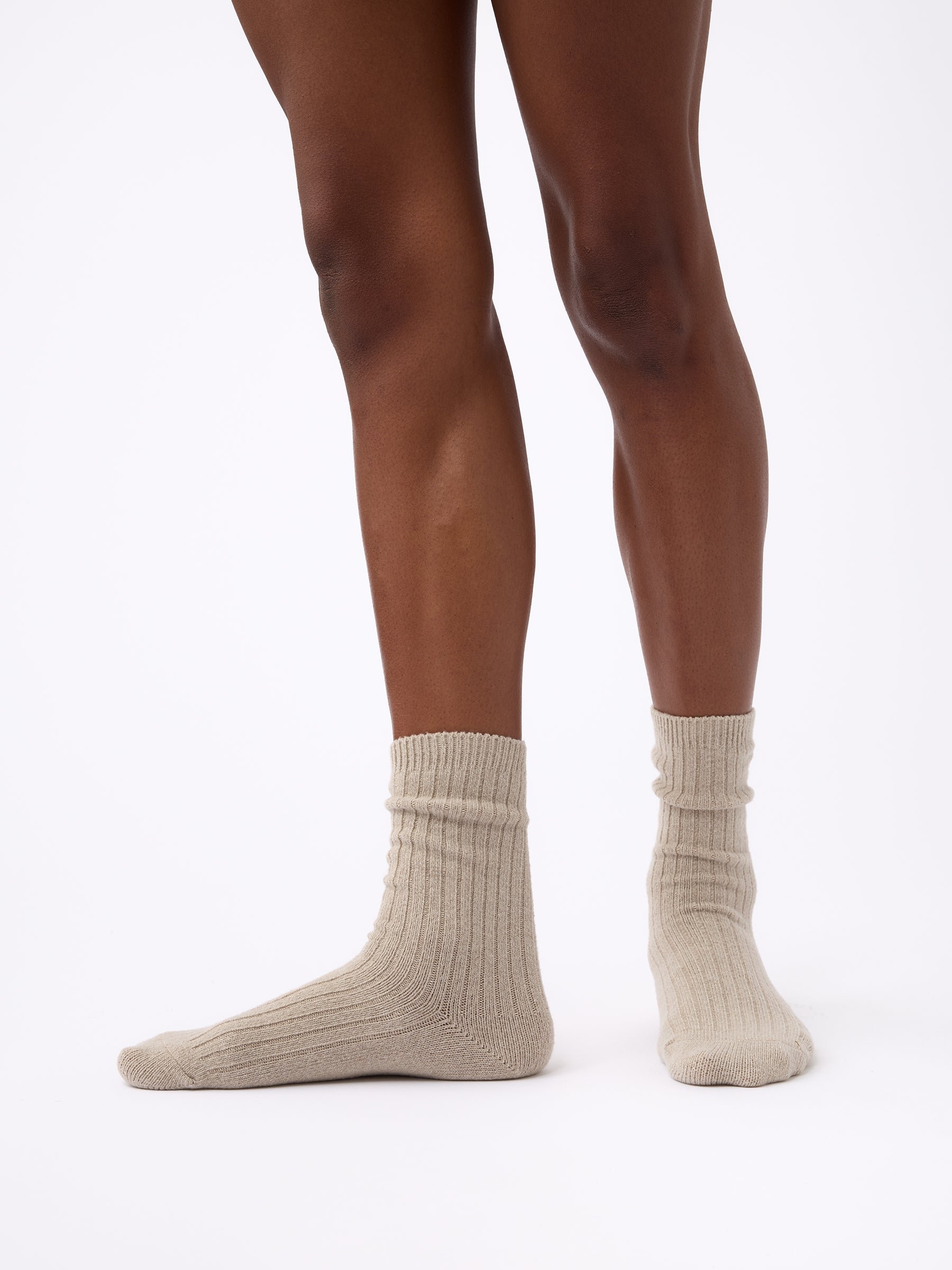 Person wearing Cozy Earth Plush Lounge Sock in Taupe 