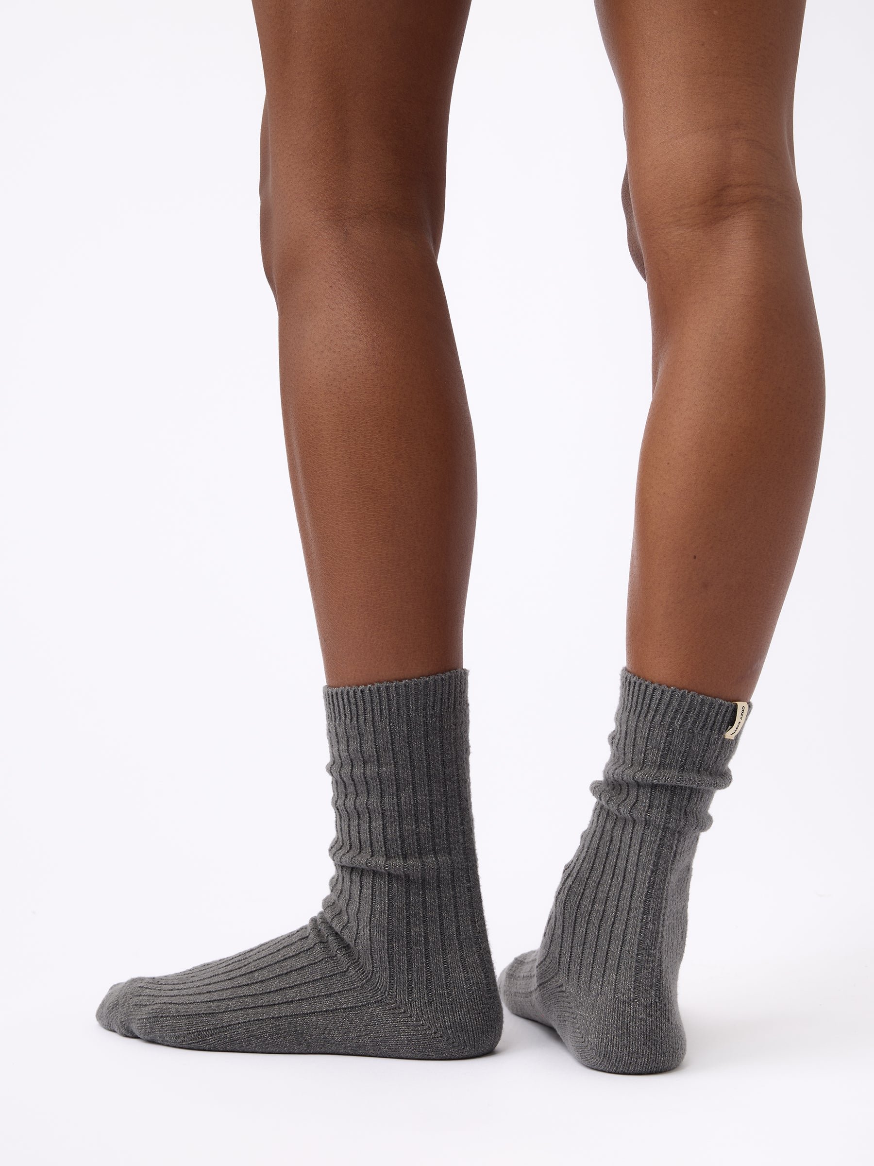 Person wearing Cozy Earth Plush Lounge Sock in Coal 