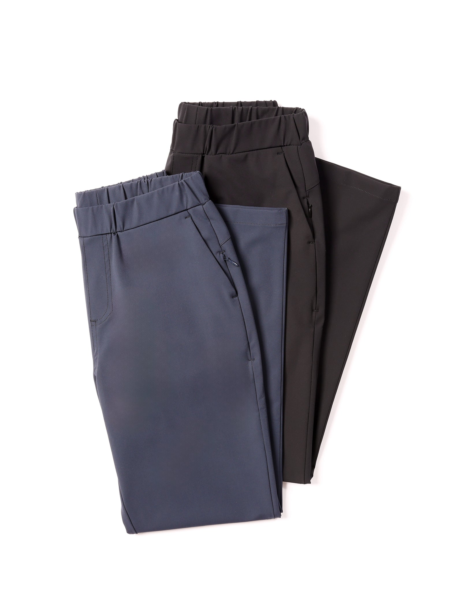 Two pairs of Cozy Earth's Women's Always Cropped Pants on a white background. One pair is navy blue and the other is black. Both pairs feature zippered side pockets and appear to be made of a smooth, lightweight fabric with an elastic waist. 